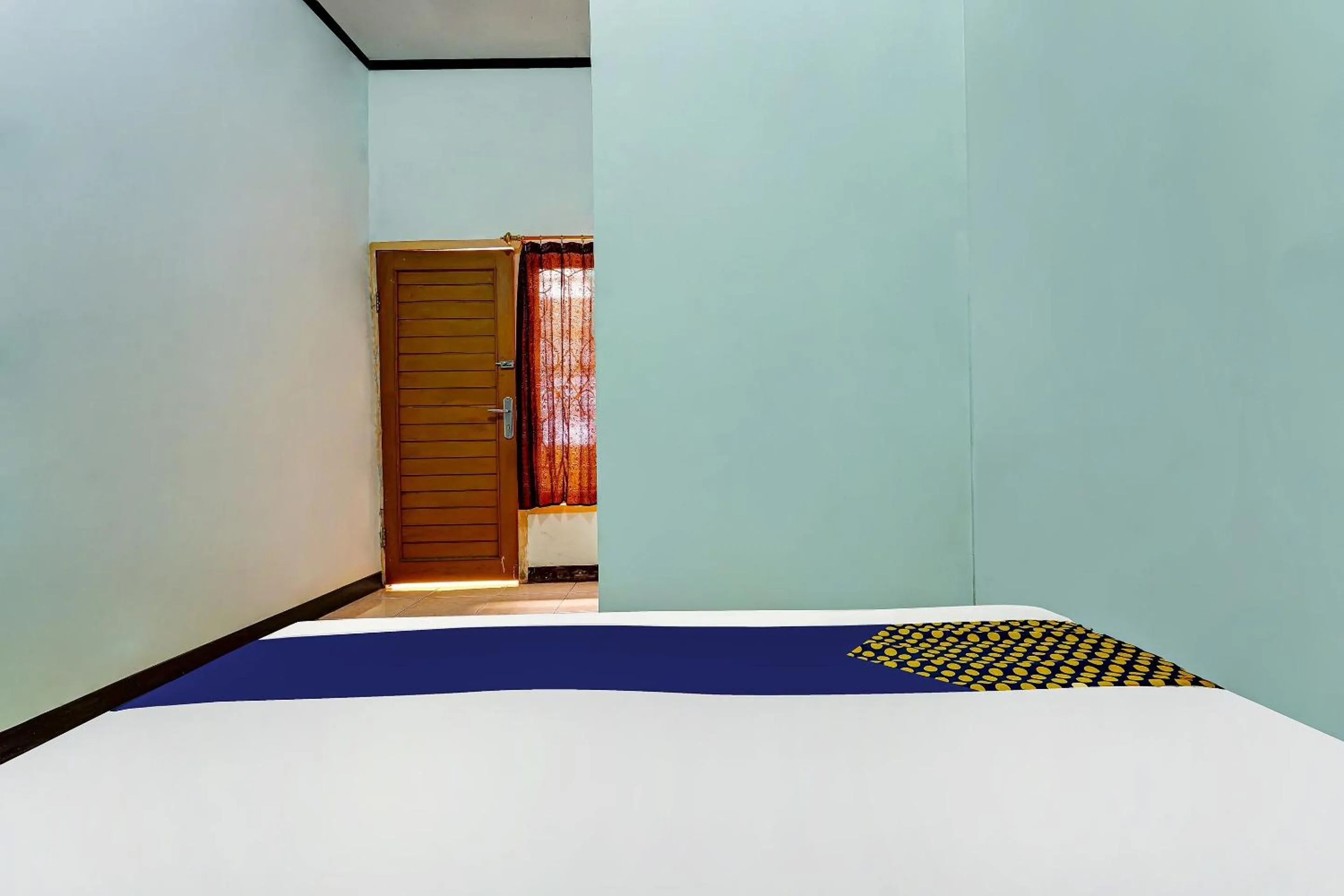 Bedroom in SPOT ON 91159 Kost Putrana Syariah