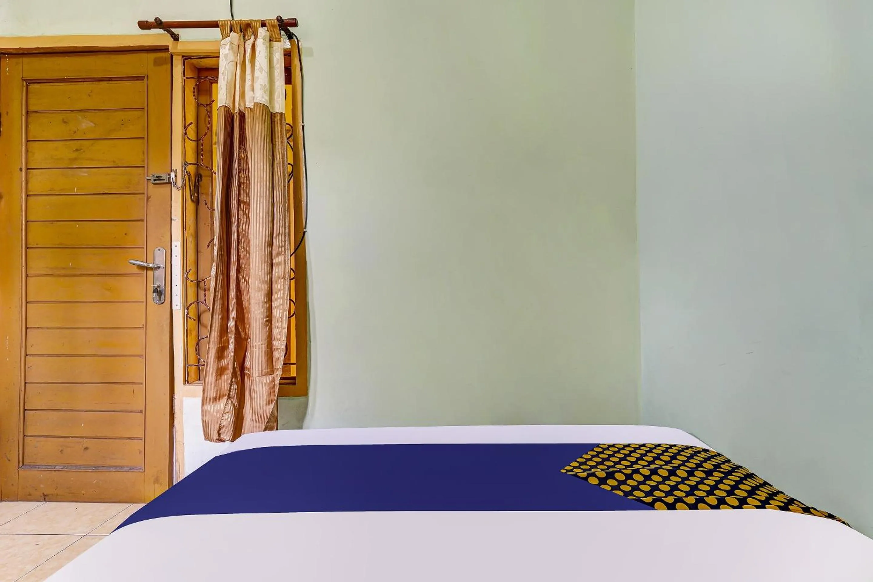 Bedroom in SPOT ON 91159 Kost Putrana Syariah