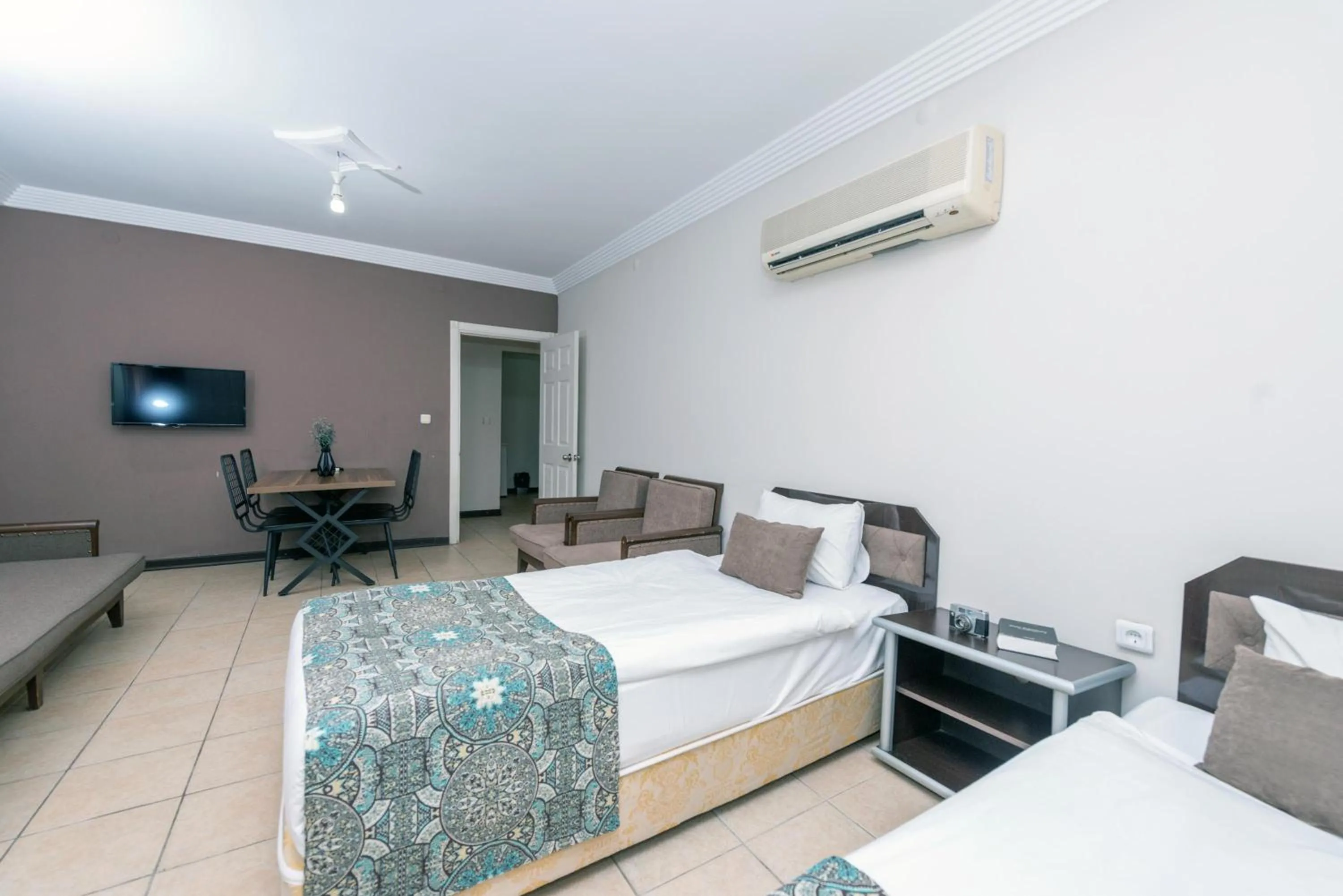 Bed in City Inn Family Apart