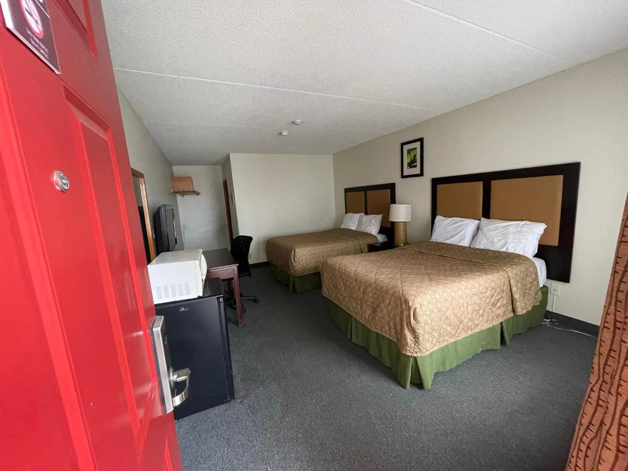 Bed in Heritage Inn & Suites