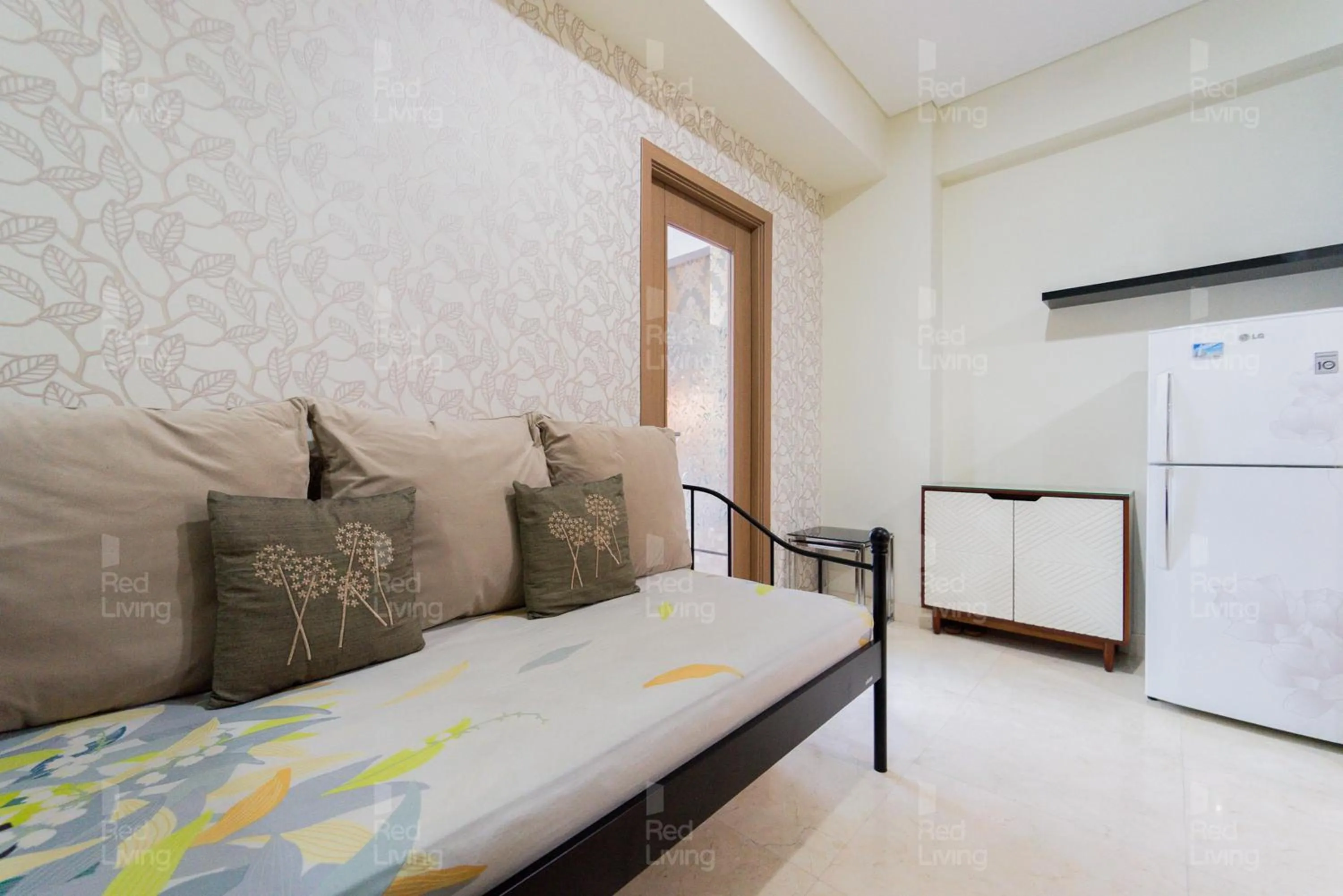 Living room, Bed in RedLiving Apartemen Puri Orchard - Tower Magnolia