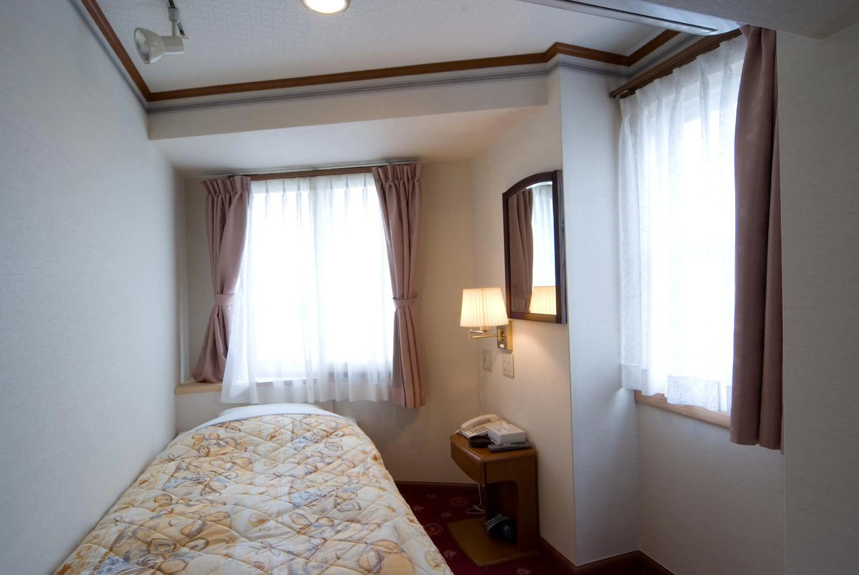 Bed in Beppu Station Hotel
