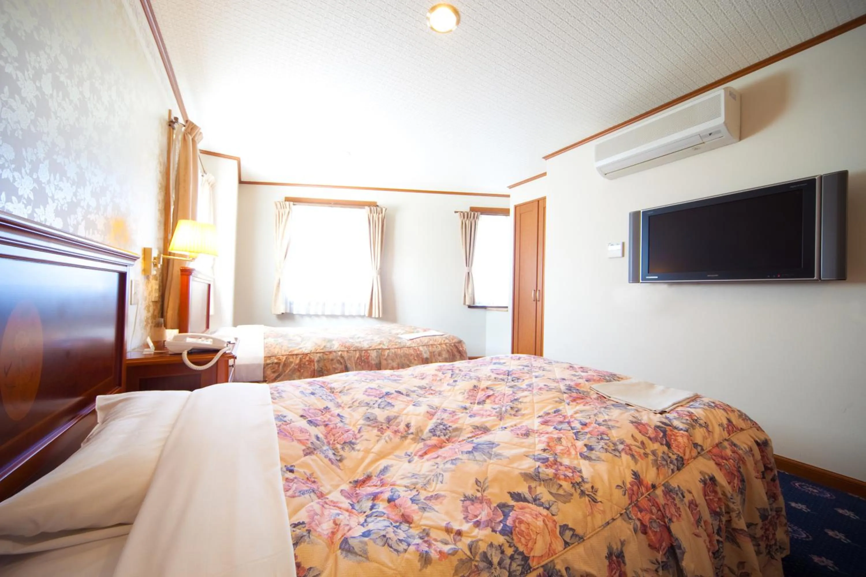 Bed in Beppu Station Hotel