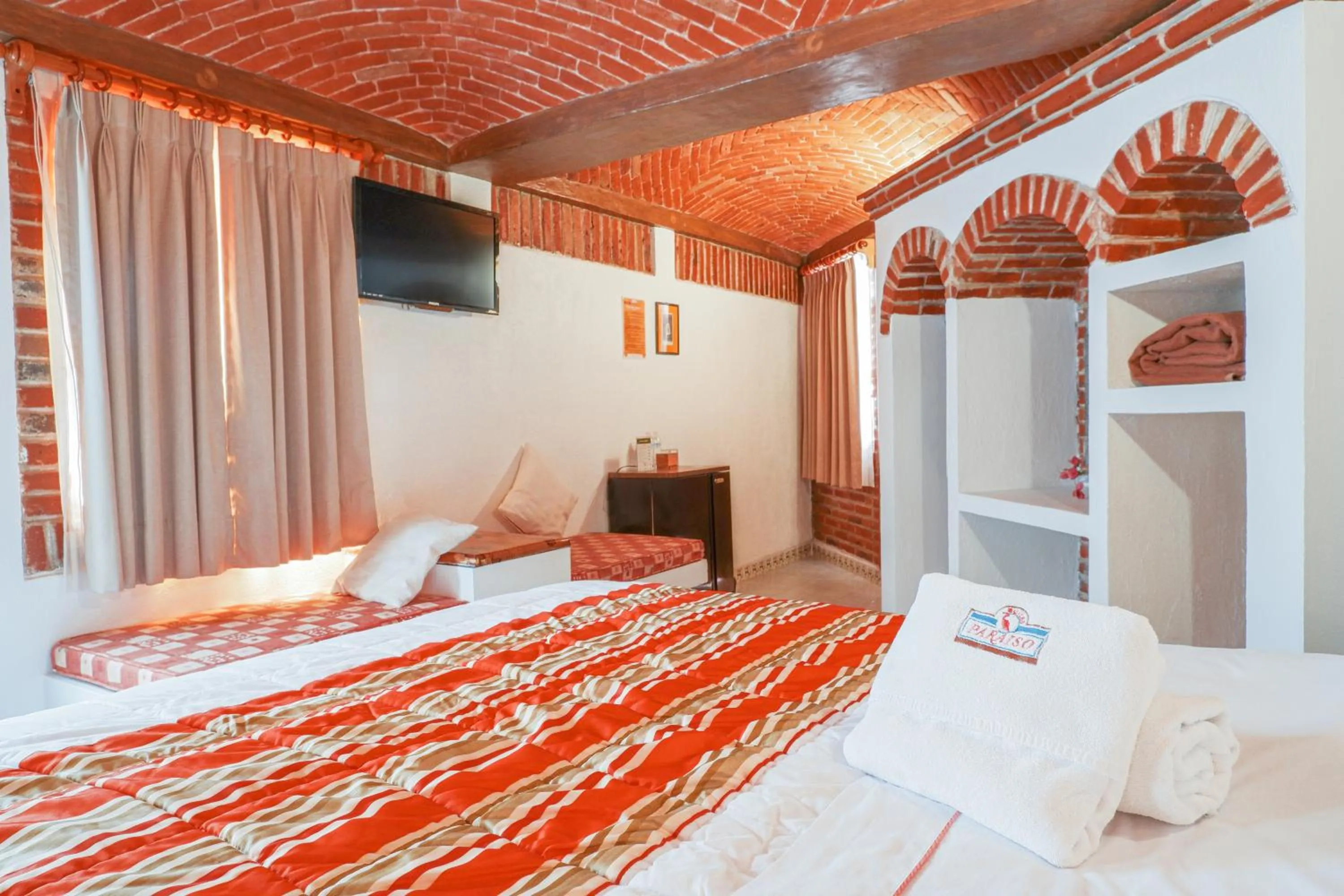 Bed in Suites Paraiso Tequis