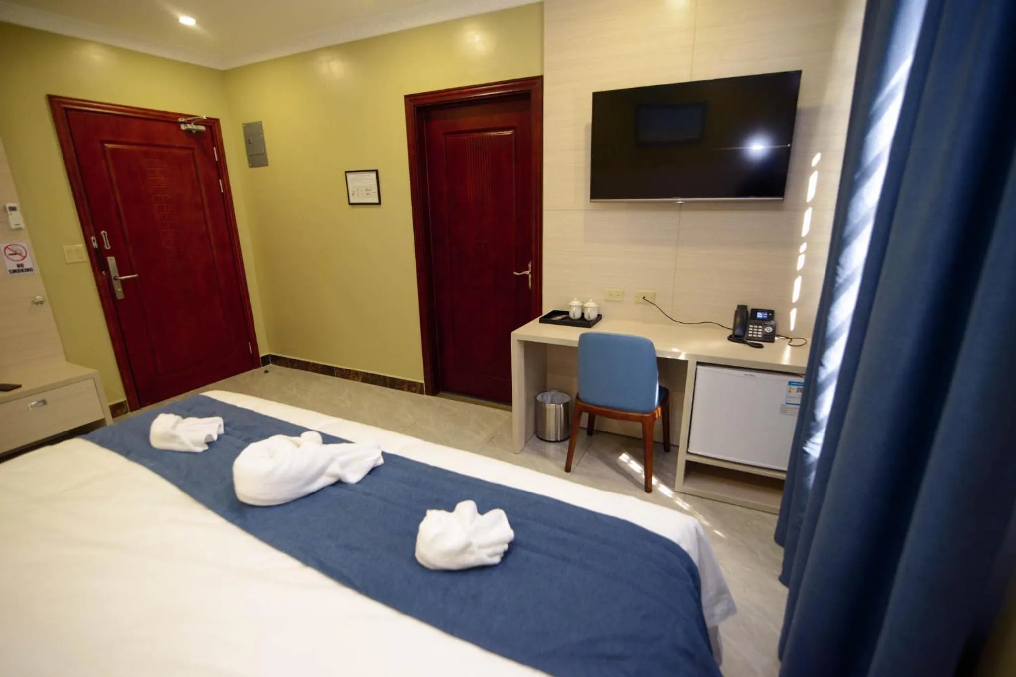 TV and multimedia, Bed in The Caye Hotel Caye Caulker