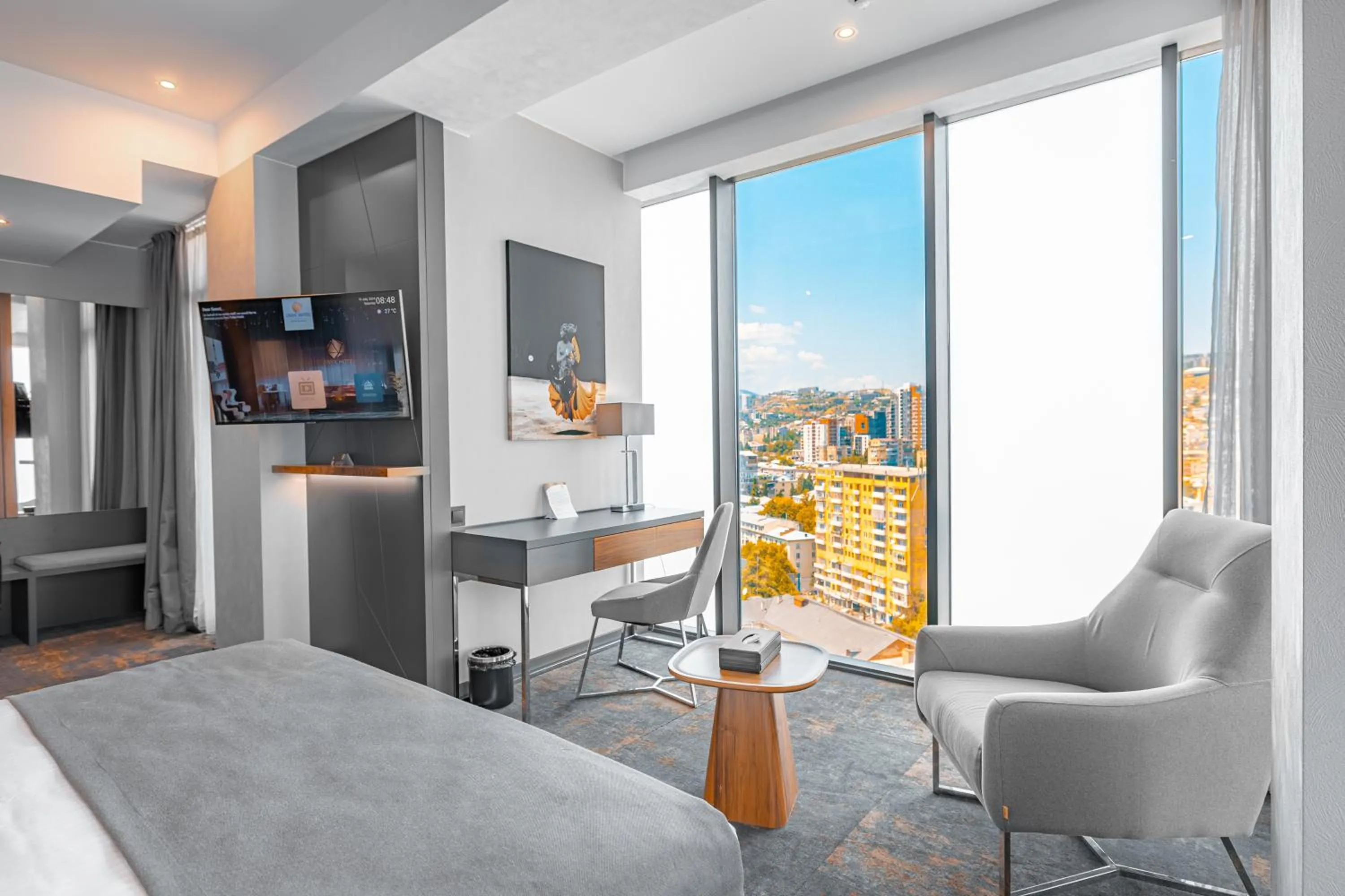 Communal lounge/ TV room, Bed in Onyx City Center