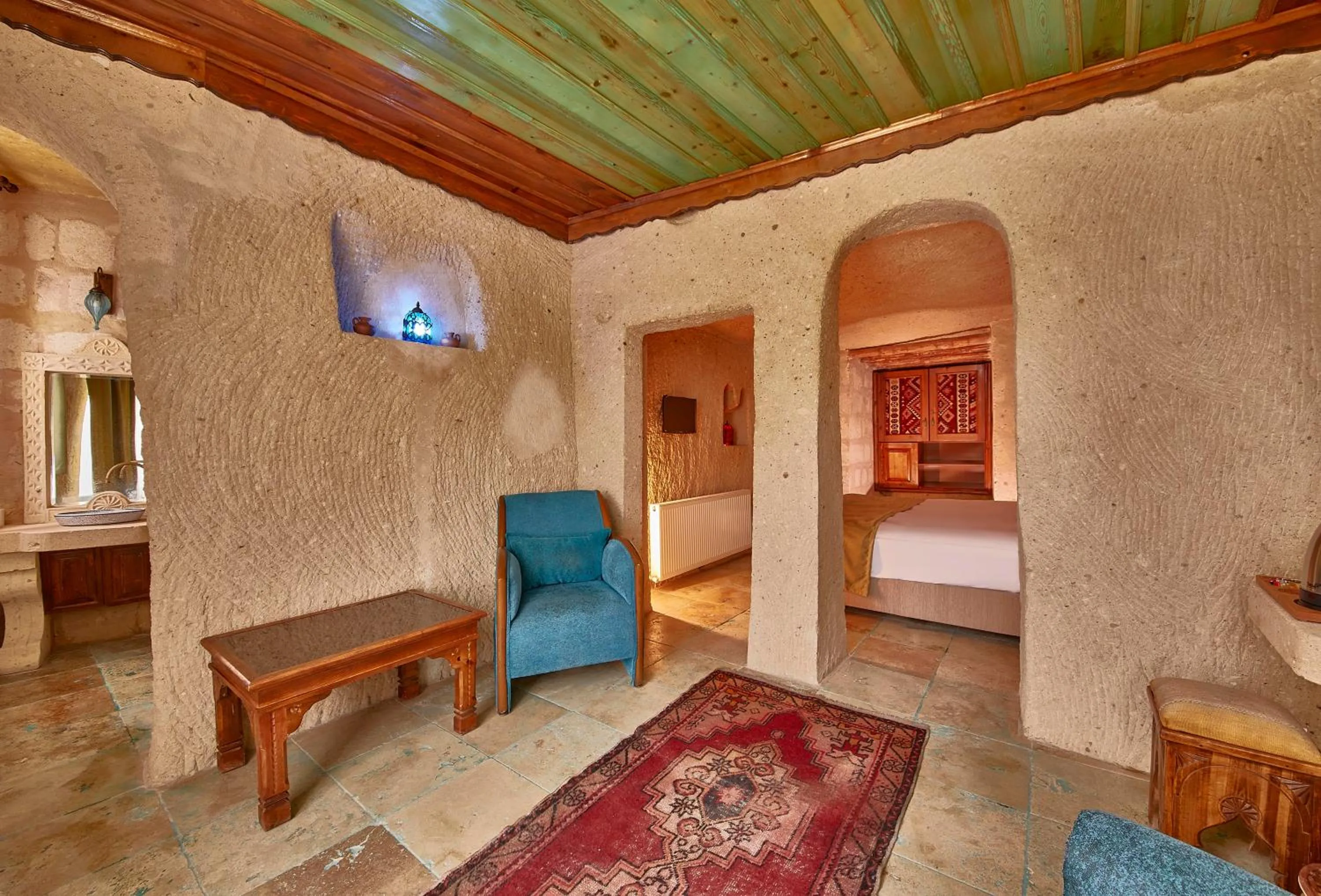 Seating area, Bed in Charm Of Cappadocia Cave Suites