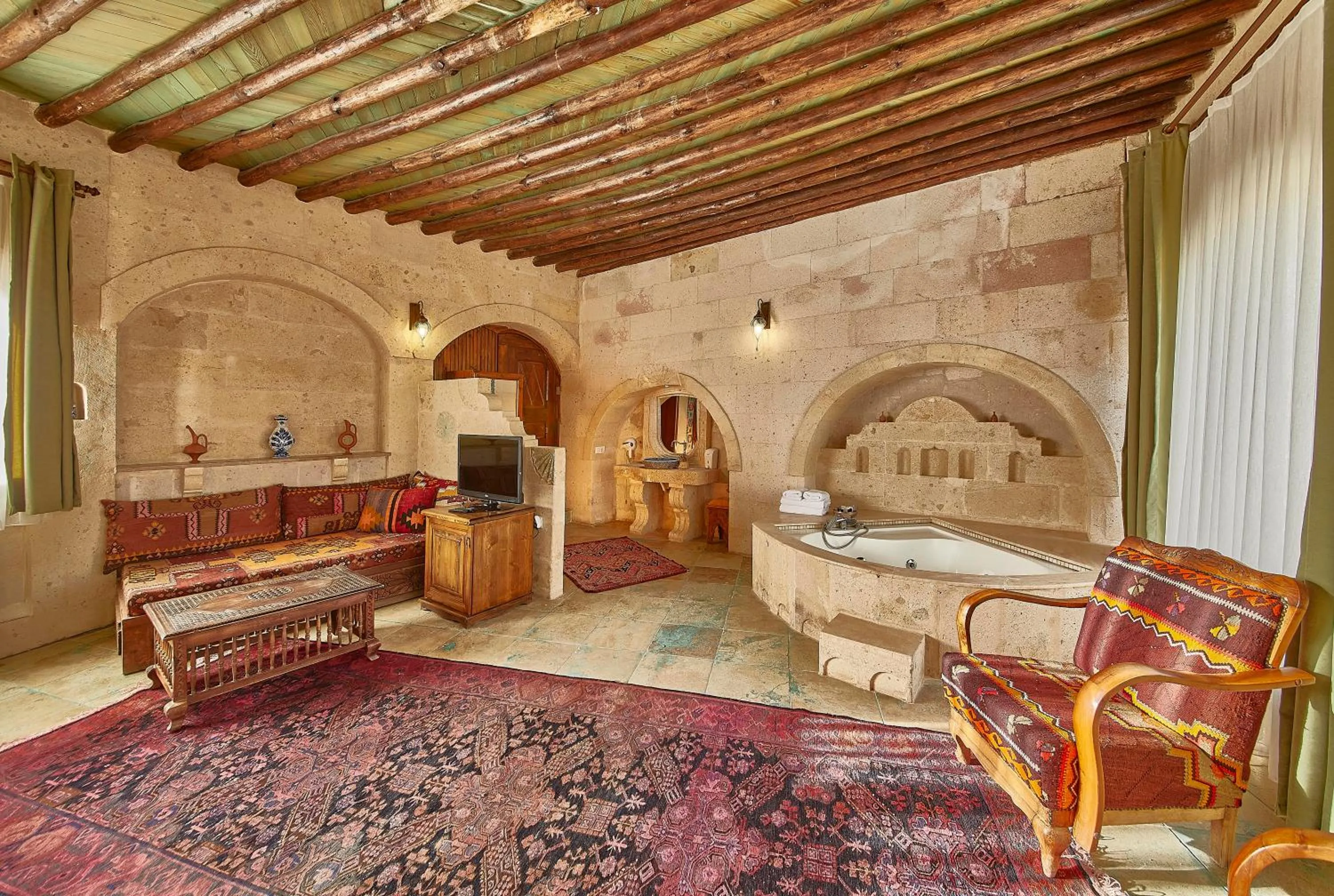 Seating area, Bed in Charm Of Cappadocia Cave Suites