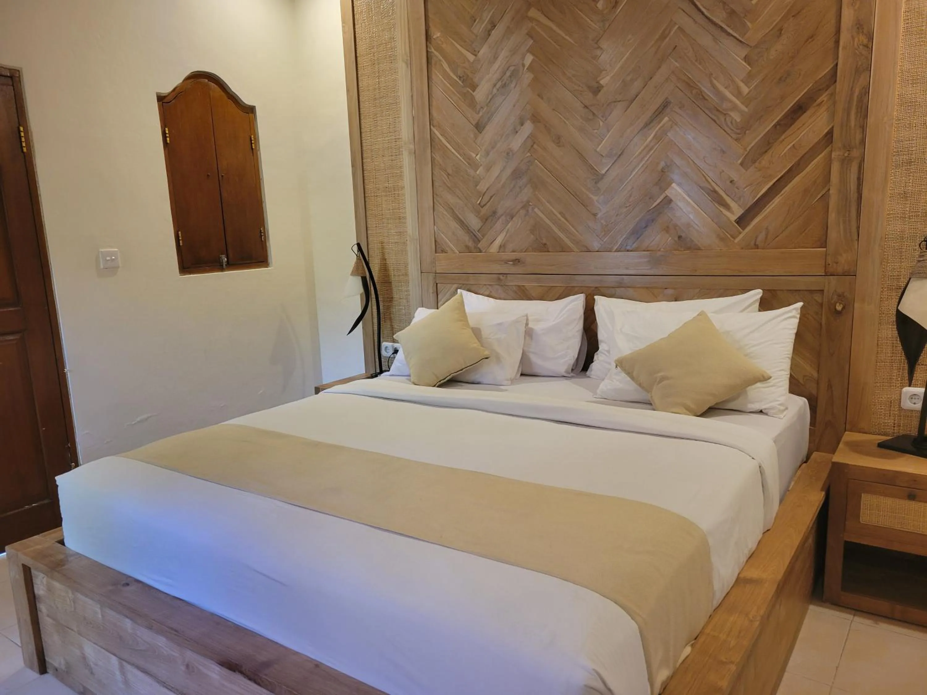 Bed in Kusnadi Hotel