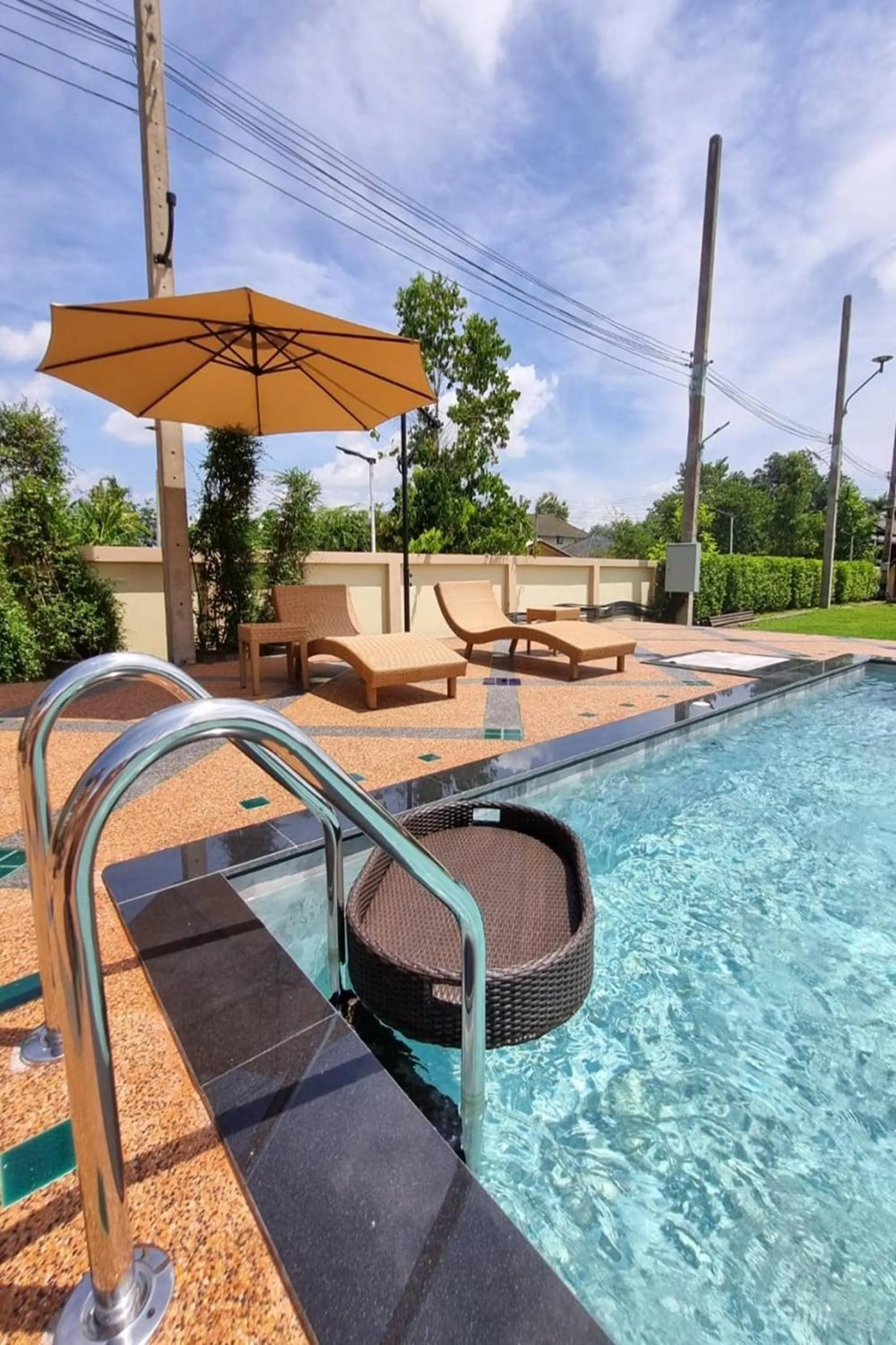 Swimming pool in Siri Nakornpink Chiang Mai Hotel SHA Plus