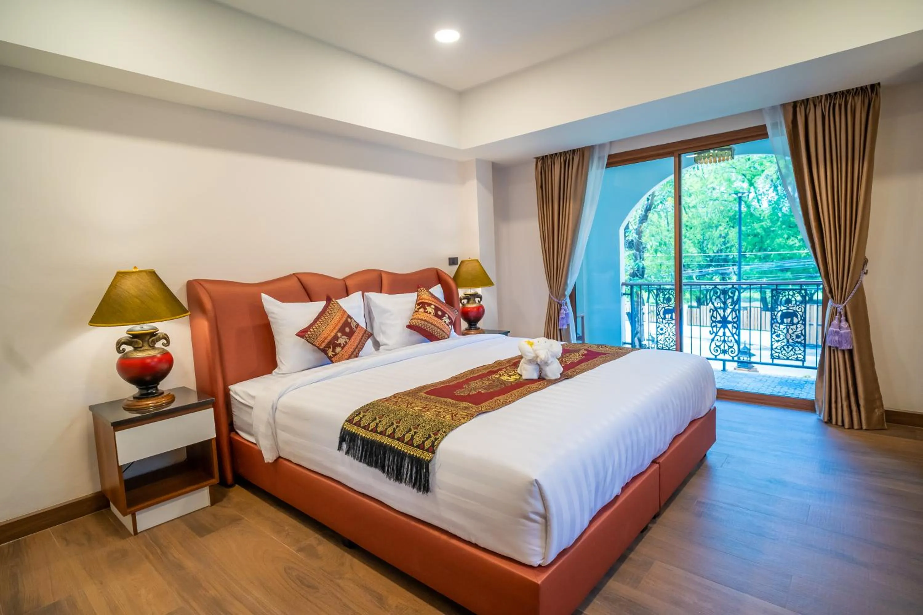 Bed in Siri Nakornpink Chiang Mai Hotel SHA Plus