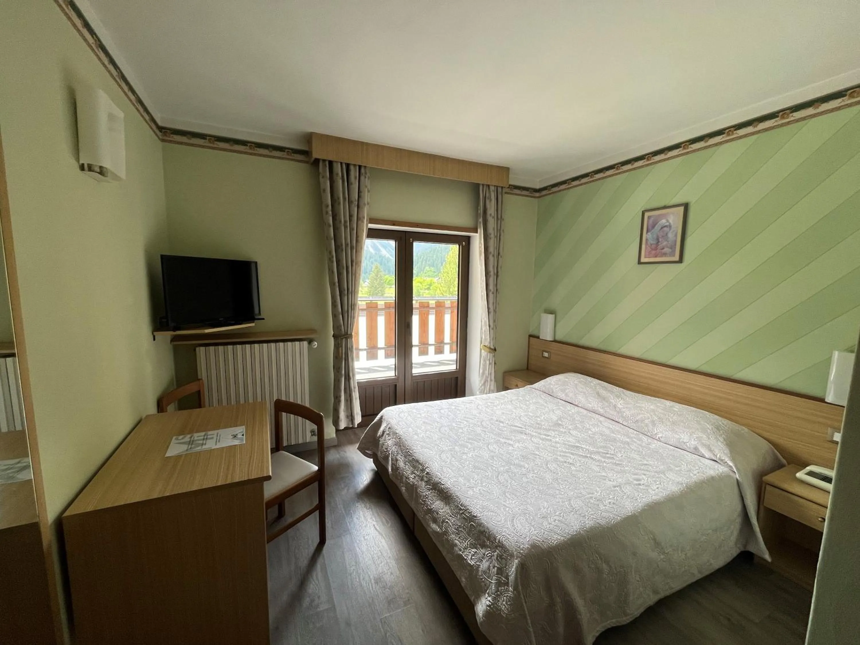 Bed in Monaco Sport Hotel