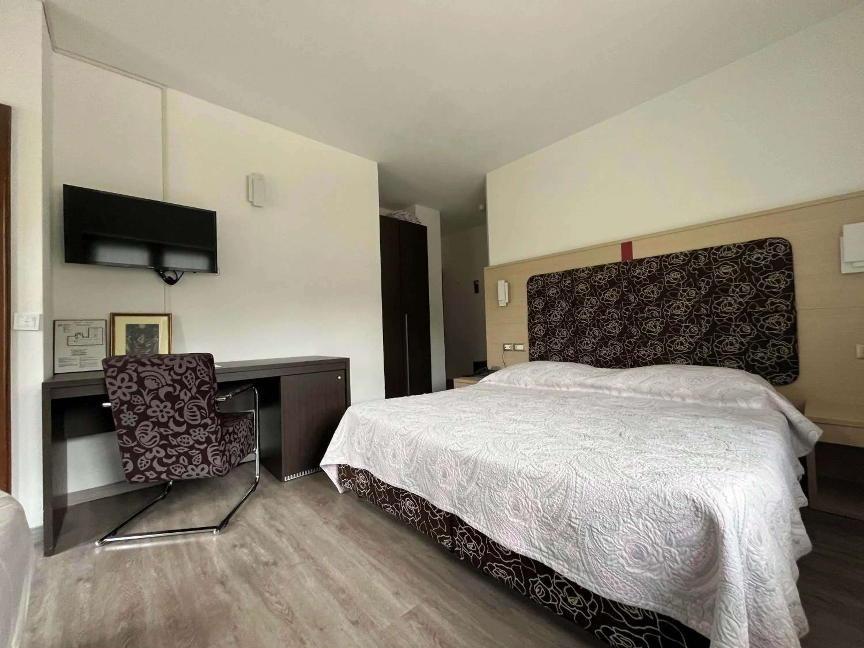 Bed in Monaco Sport Hotel