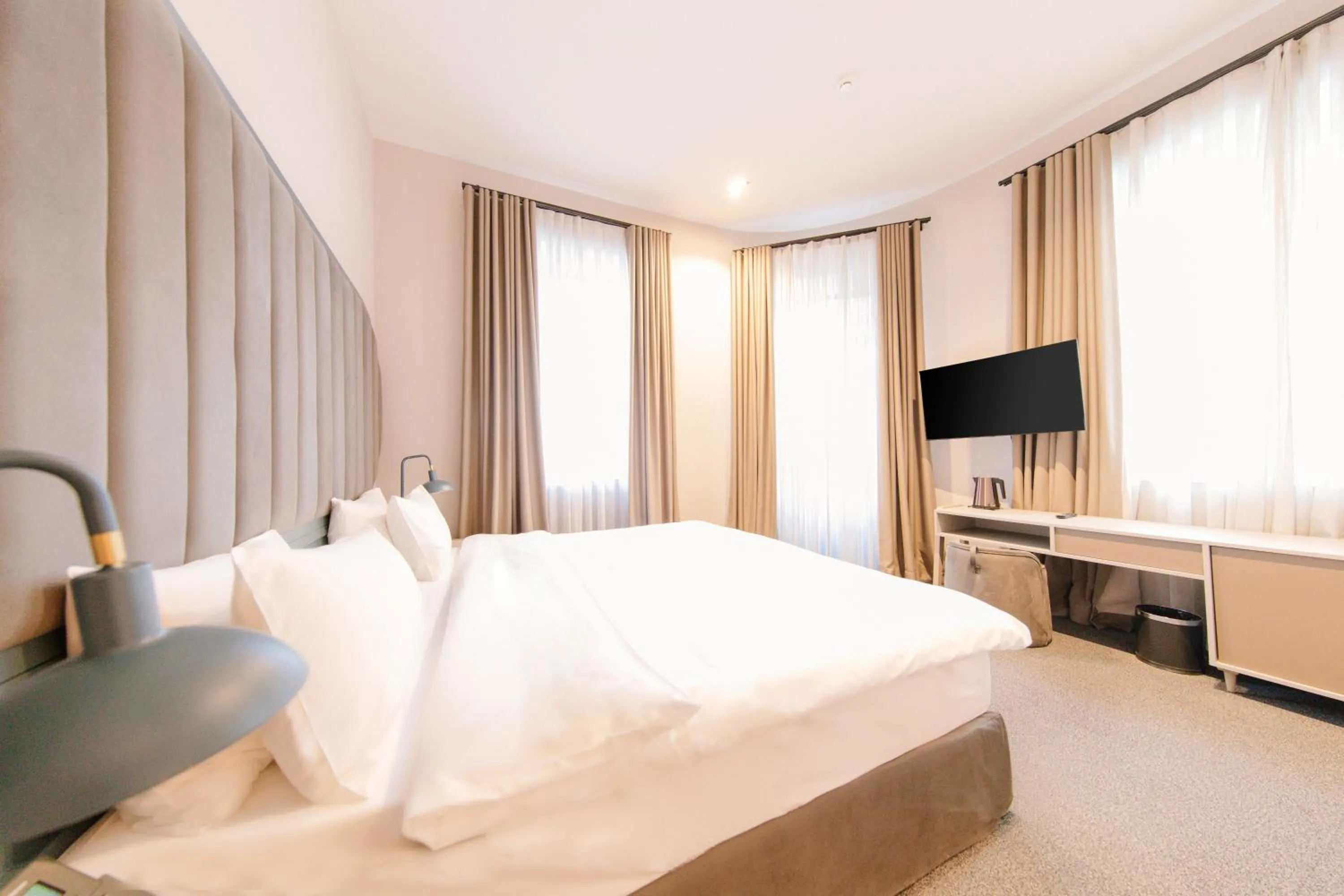 Bed in STROFI Boutique Hotel