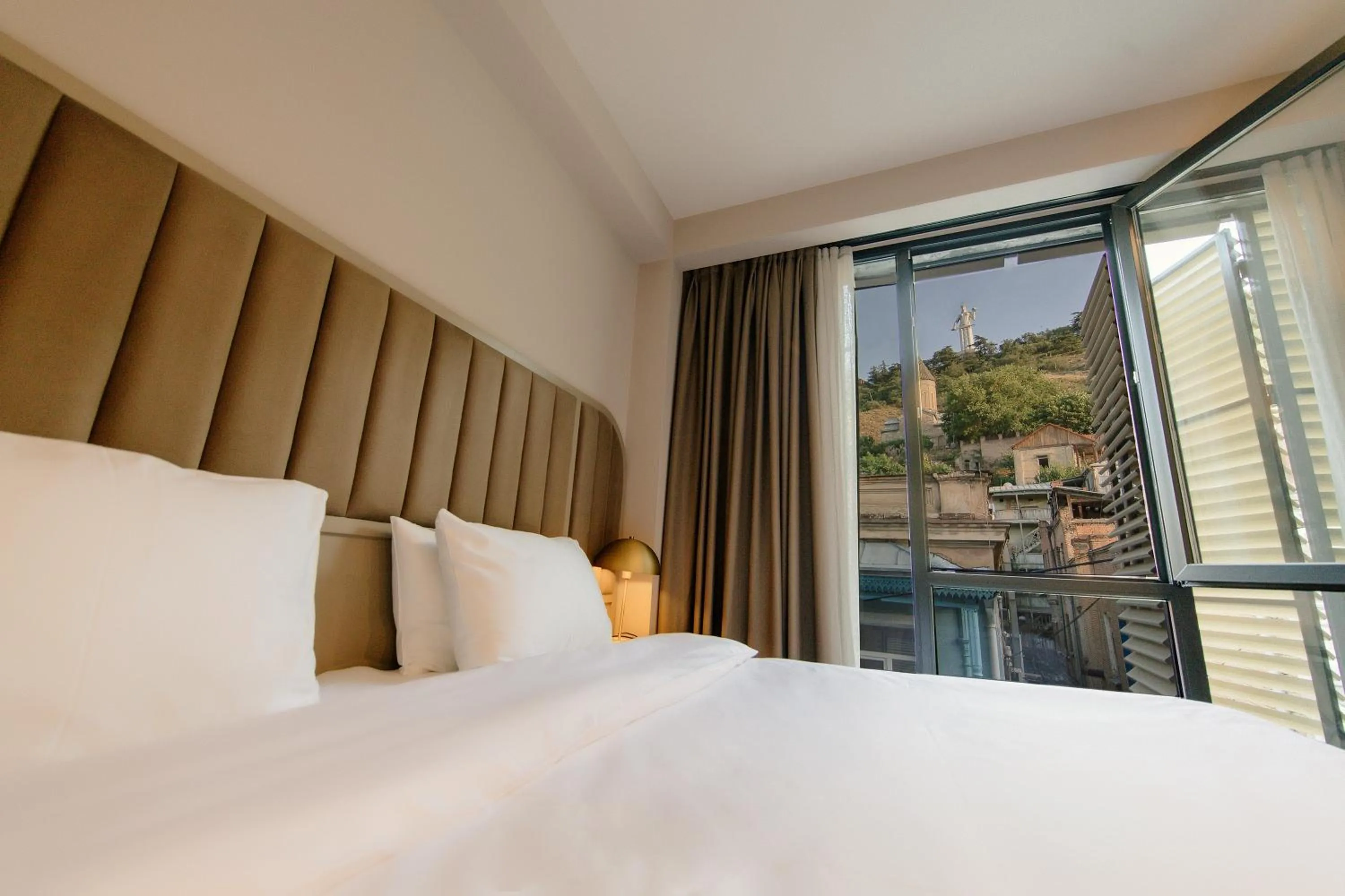 Bed in STROFI Boutique Hotel