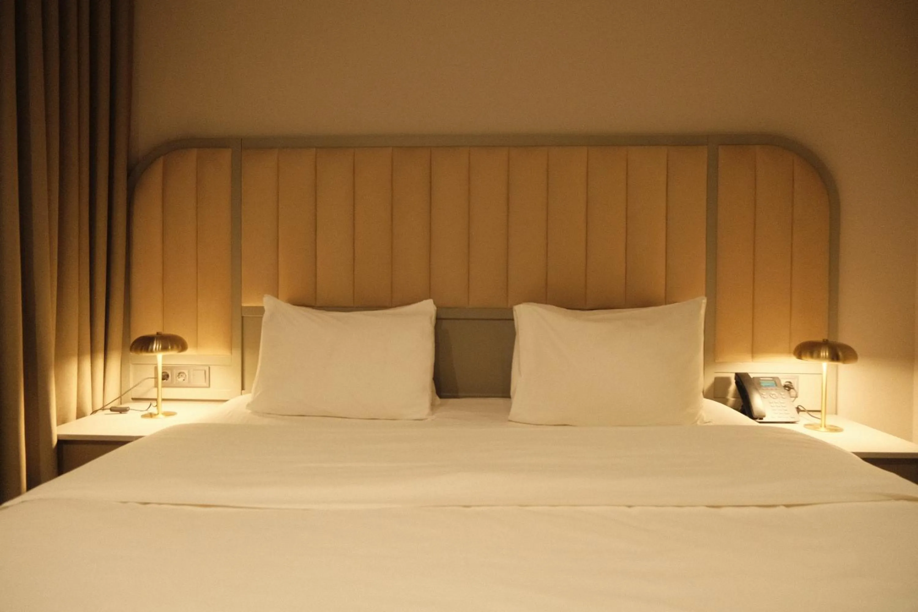 Bed in STROFI Boutique Hotel