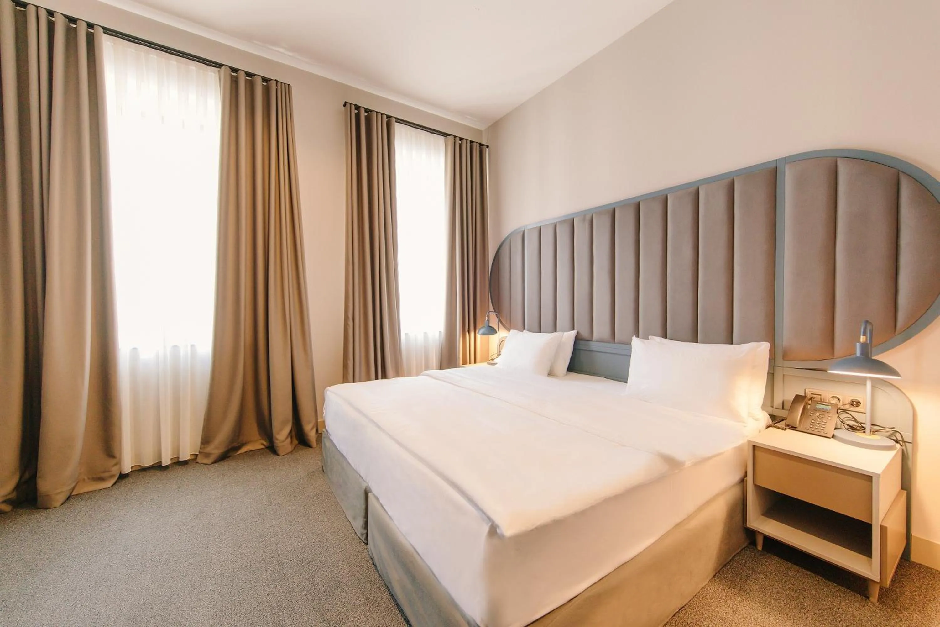 Bed in STROFI Boutique Hotel