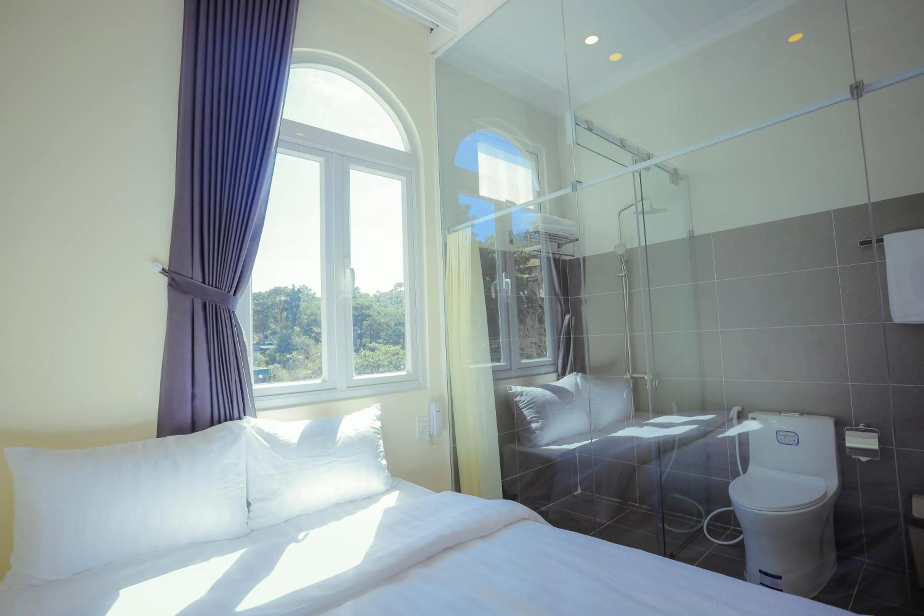 Bed in SHIN VILLAGE HOTEL