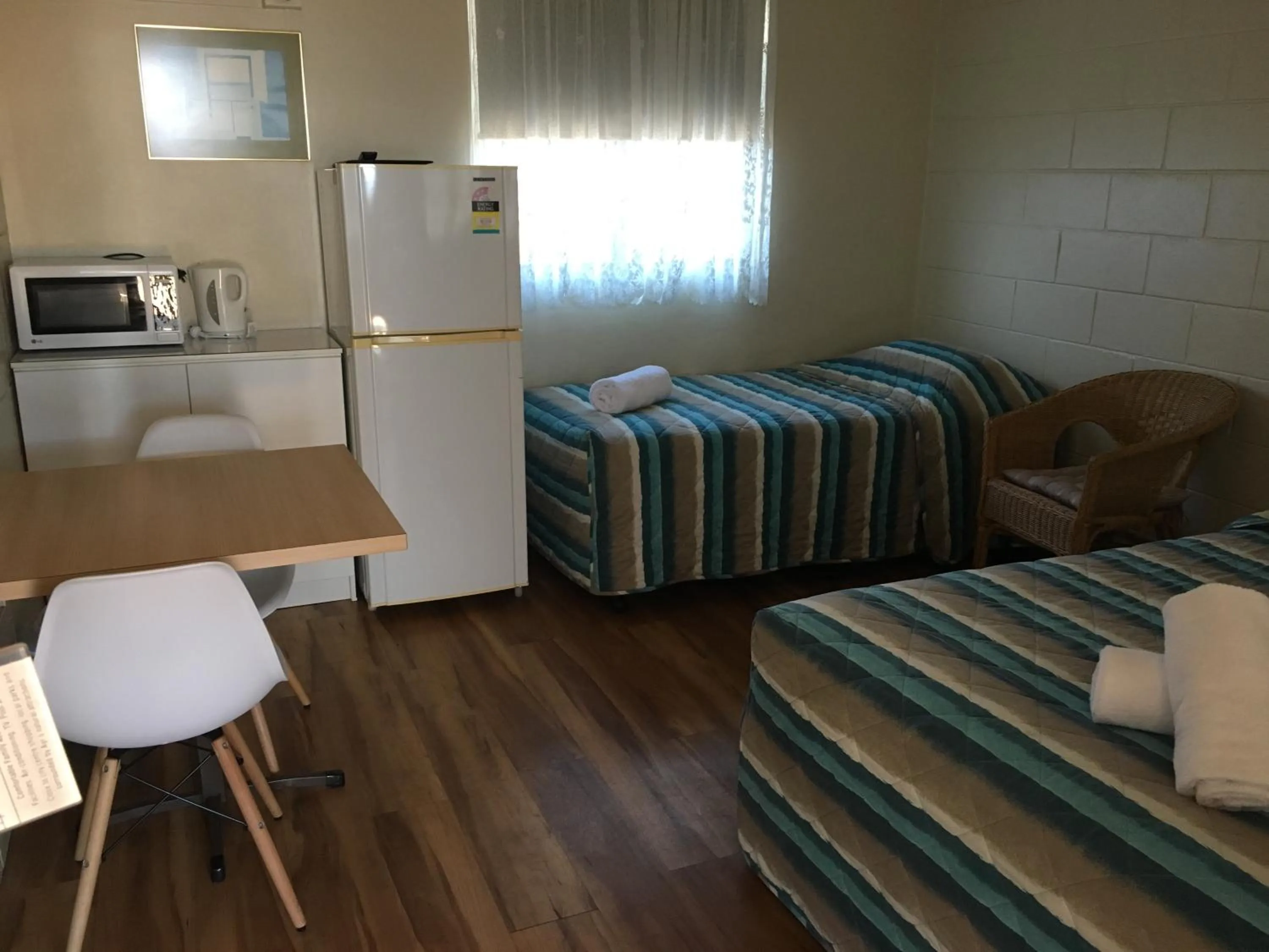 Bed in Plantation Park Motor Inn