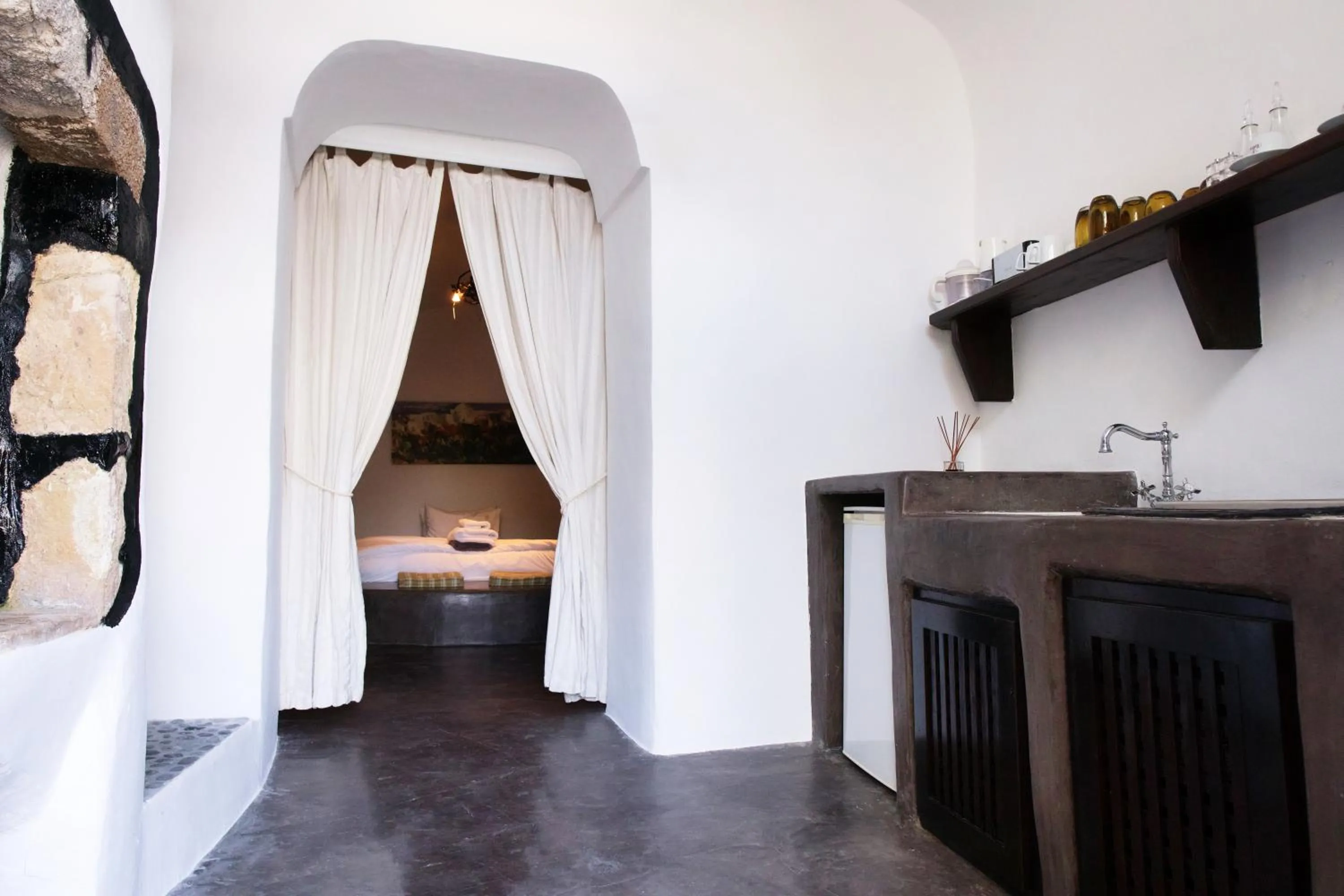 Kitchen or kitchenette, Bed in Santorini Heritage Villas