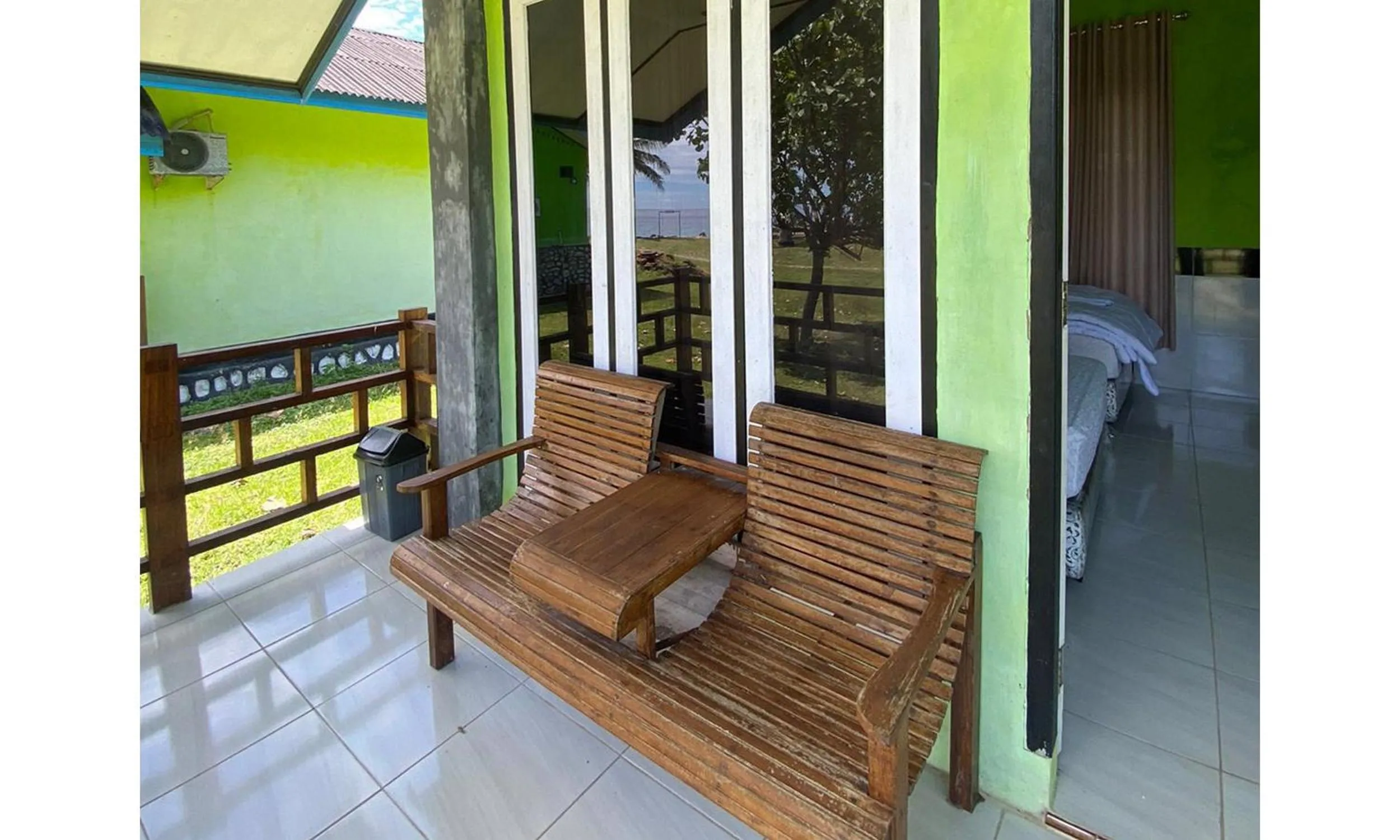 Seating area in RedDoorz Syariah near Ujong Kareung Beach Sabang