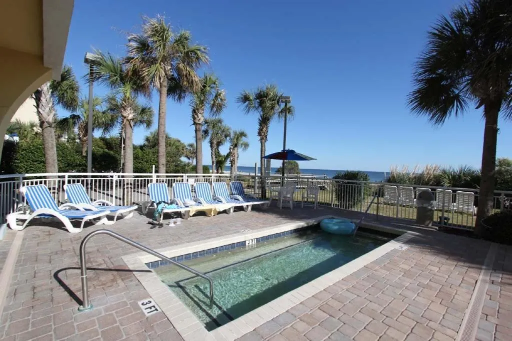 Swimming pool in Camelot By The Sea Ocean Front Condo