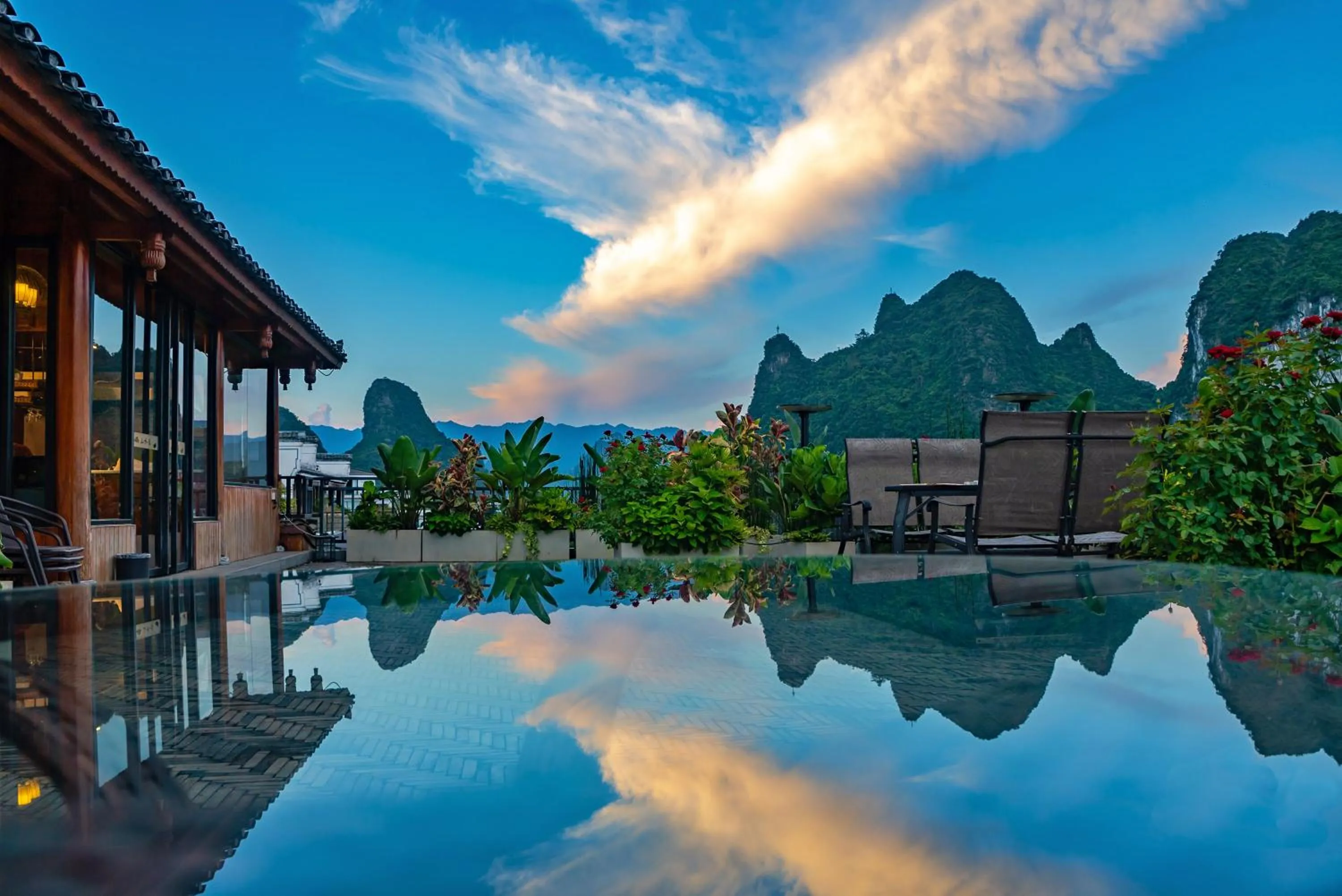Balcony/Terrace in Yangshuo Xingping Shanshuiyao Resort - Free Train Station Pick Up -Stay 3 days promotion