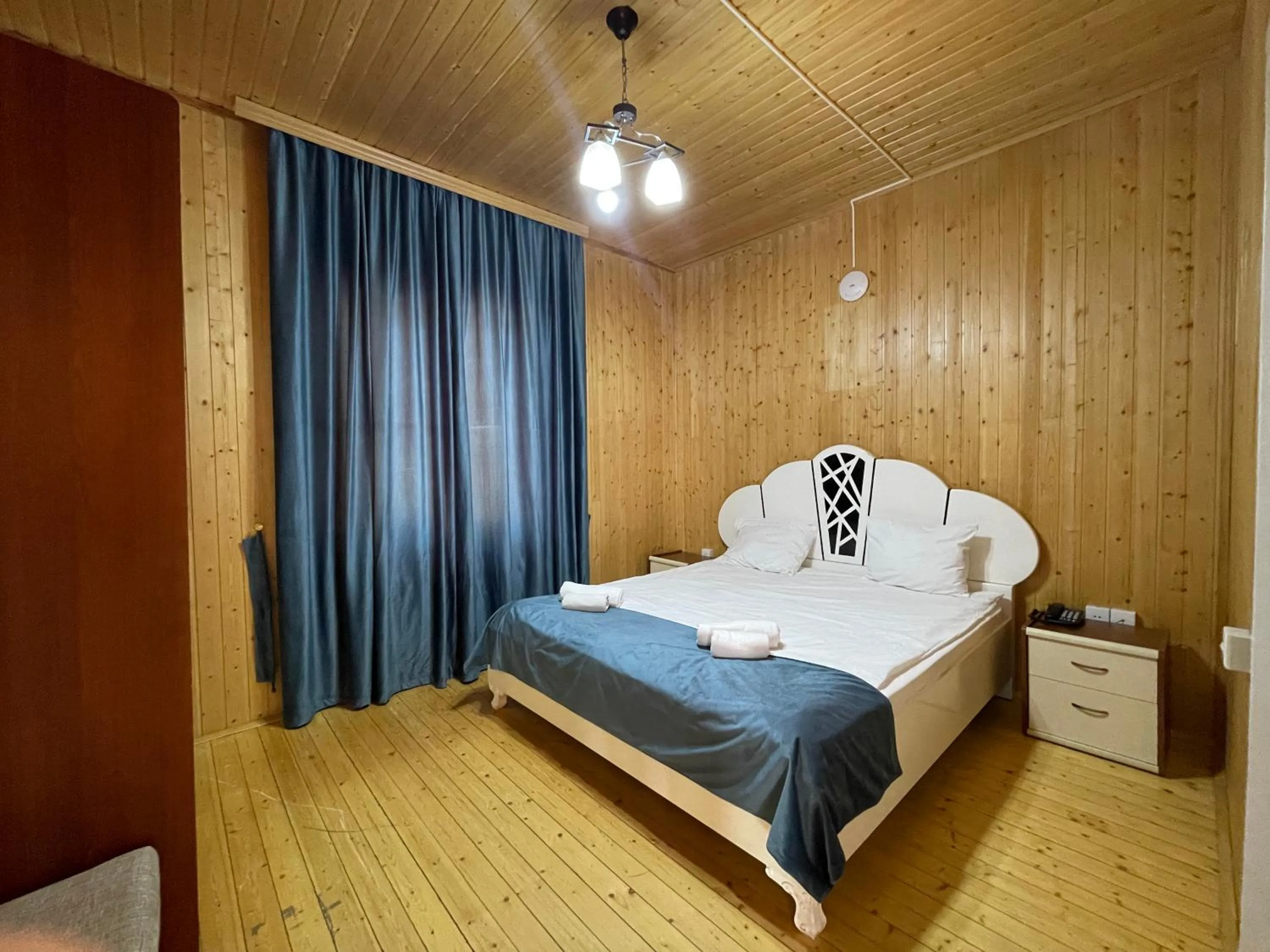 Bed in Deluxe Park Qusar Resort & Spa Hotel