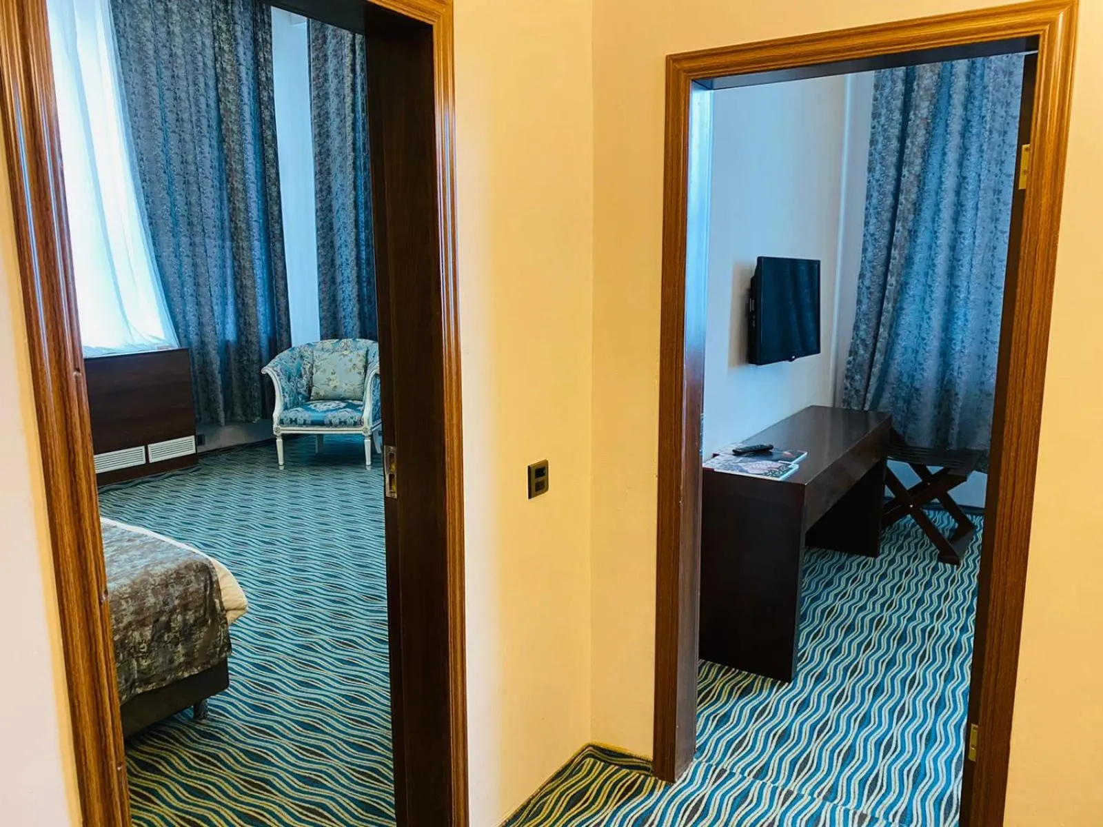 Communal lounge/ TV room, Bed in Ruma Port Hotel