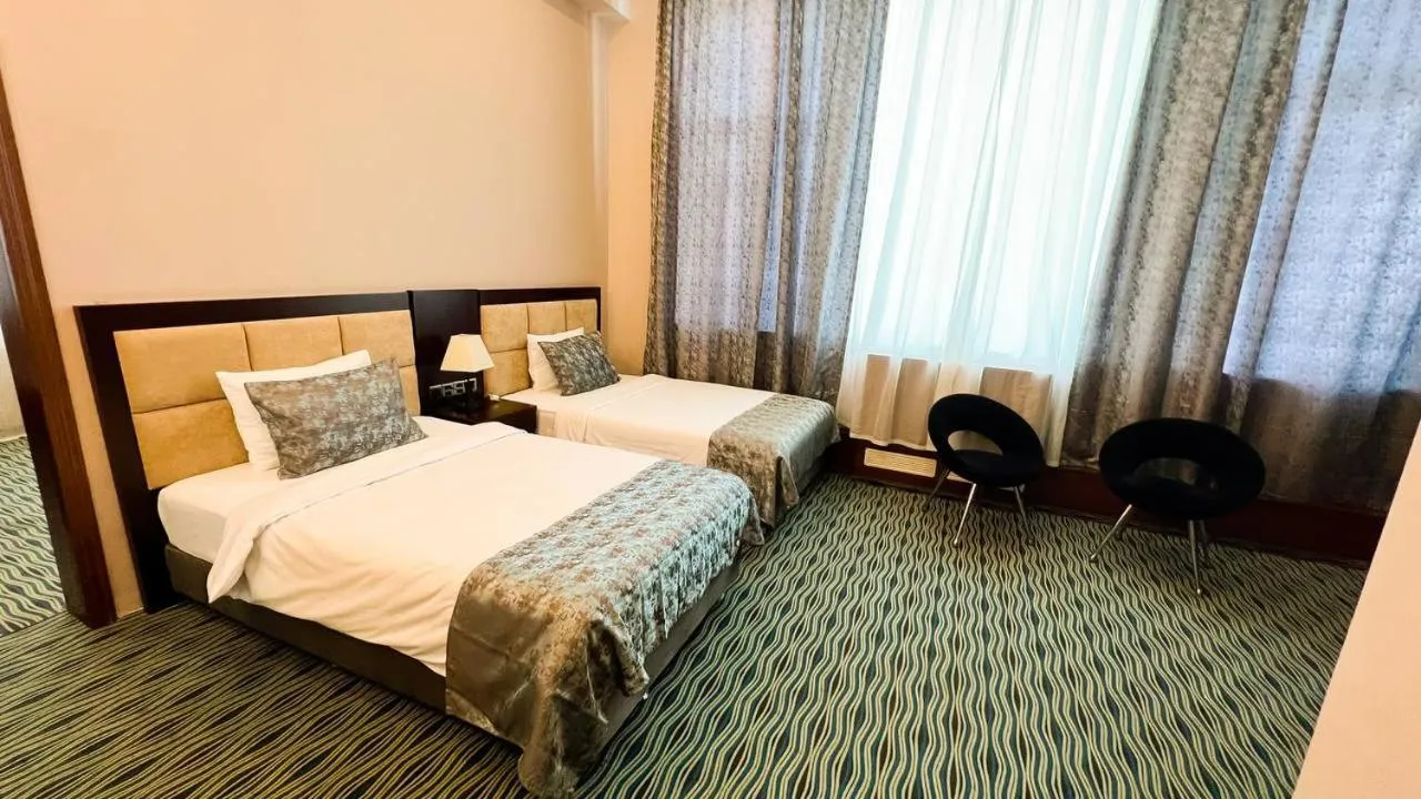 Bed in Ruma Port Hotel