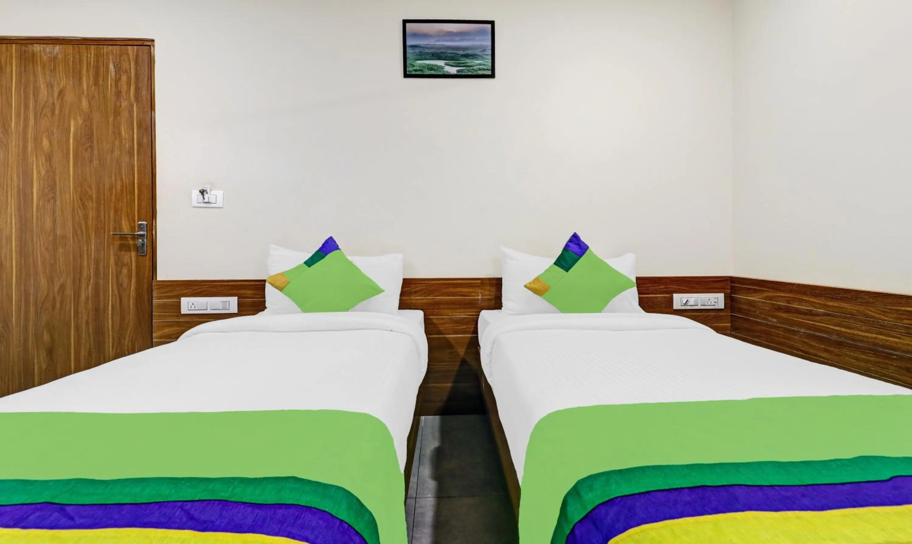 Bedroom, Bed in Treebo Purple Orchid Boutique