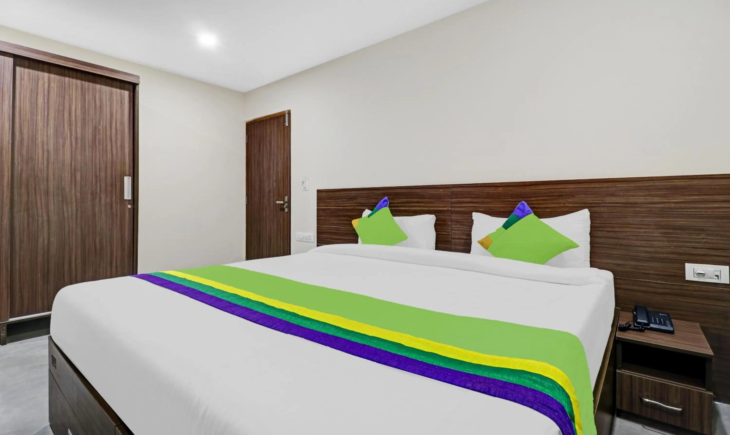 Bedroom, Bed in Treebo Purple Orchid Boutique