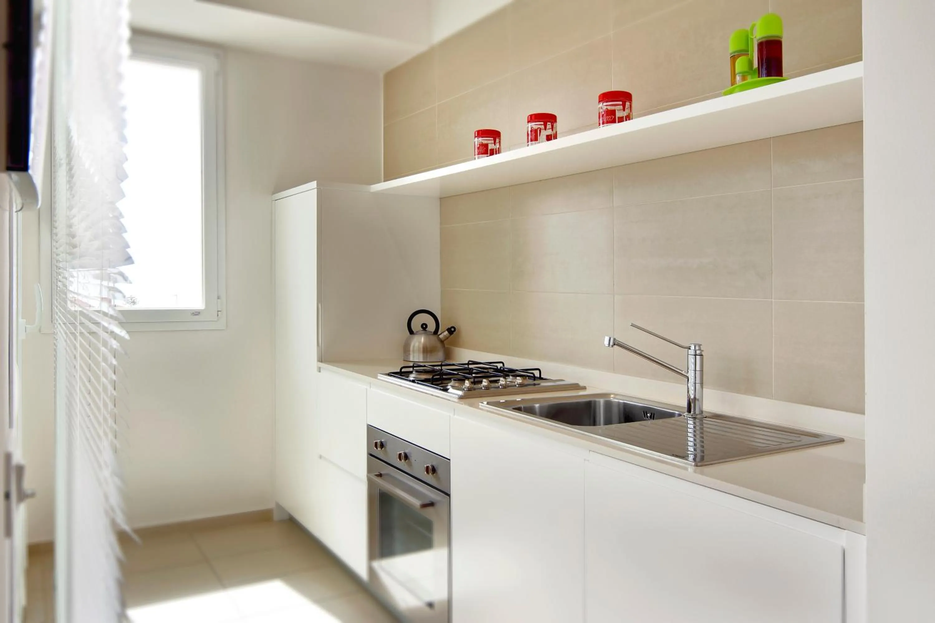 Kitchen or kitchenette in Appartamenti Sud Est