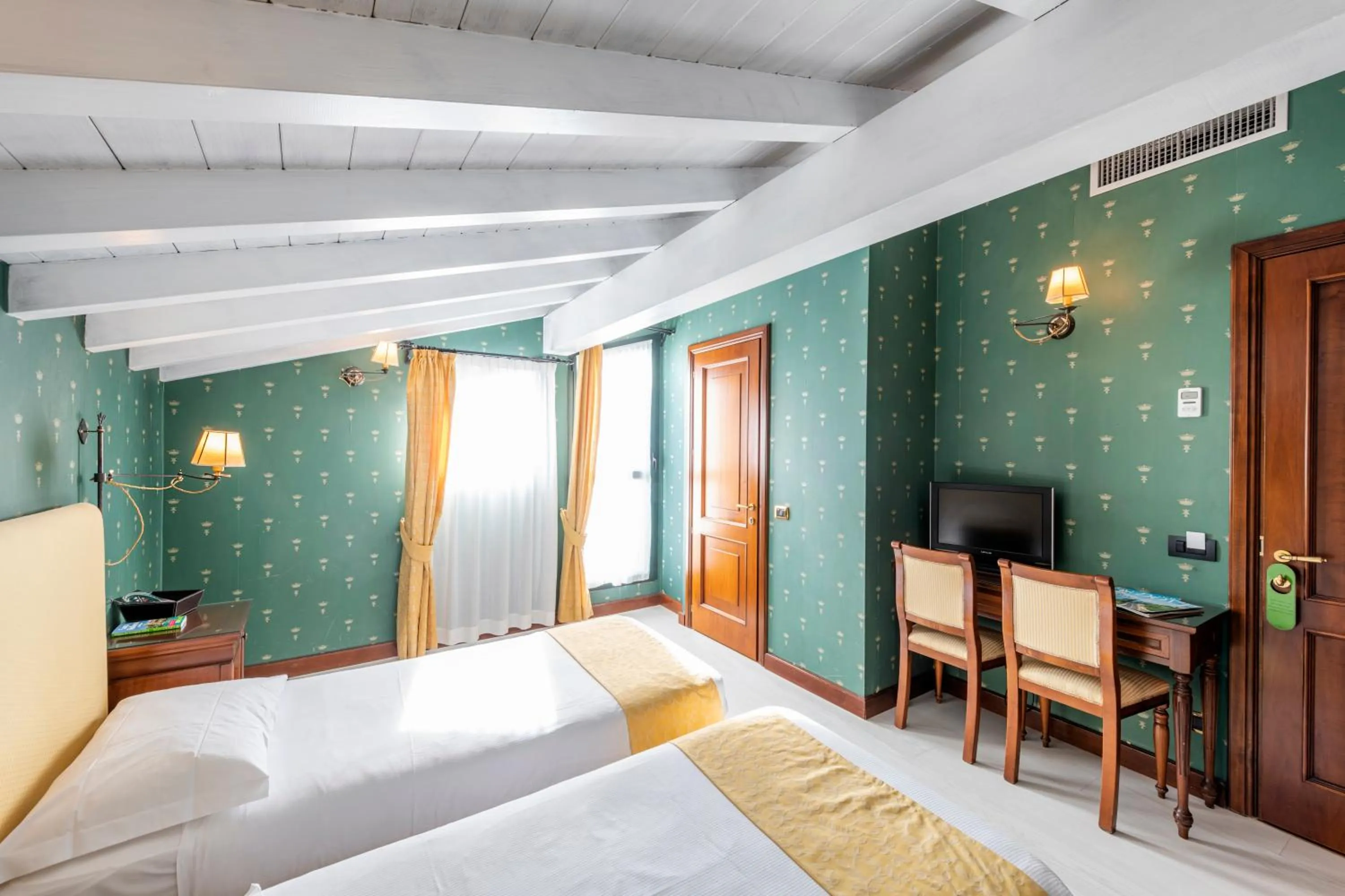 Photo of the whole room, Bed in Hotel Du Lac Menaggio