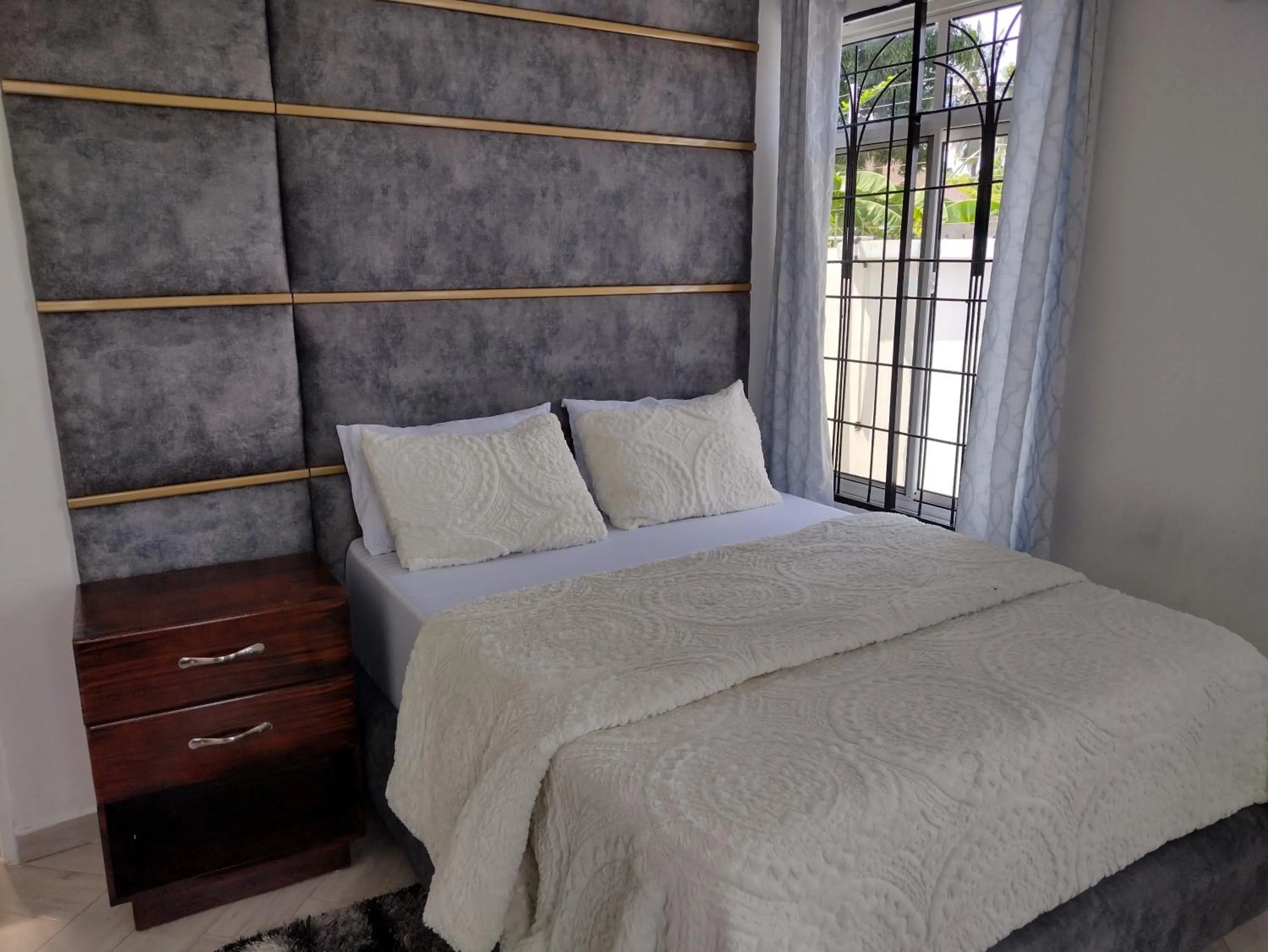 Bedroom, Bed in Mkamiti Villa - Airport Hotel with Free Shuttle