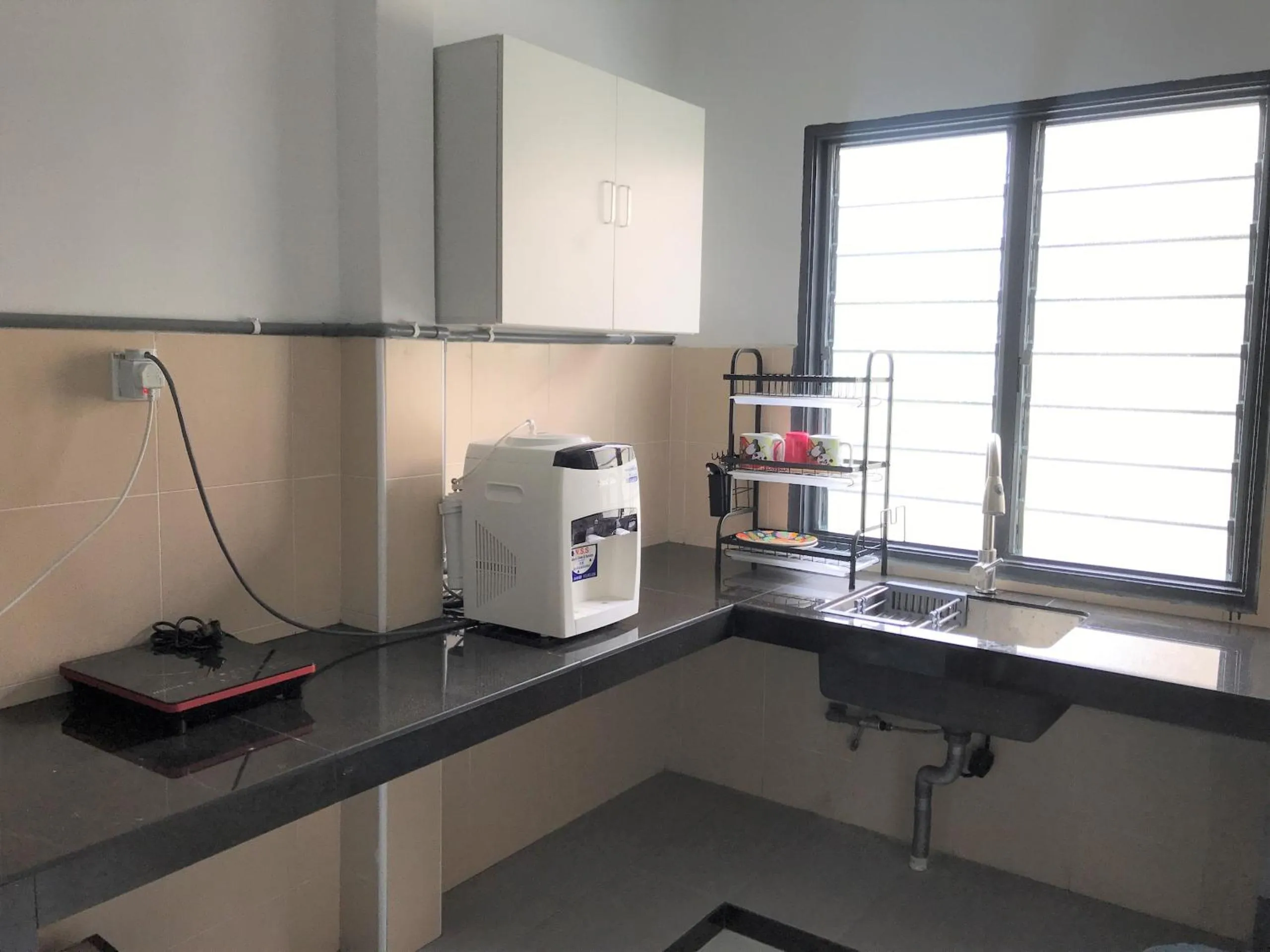 Kitchen or kitchenette in OYO 90493 JL Homestay