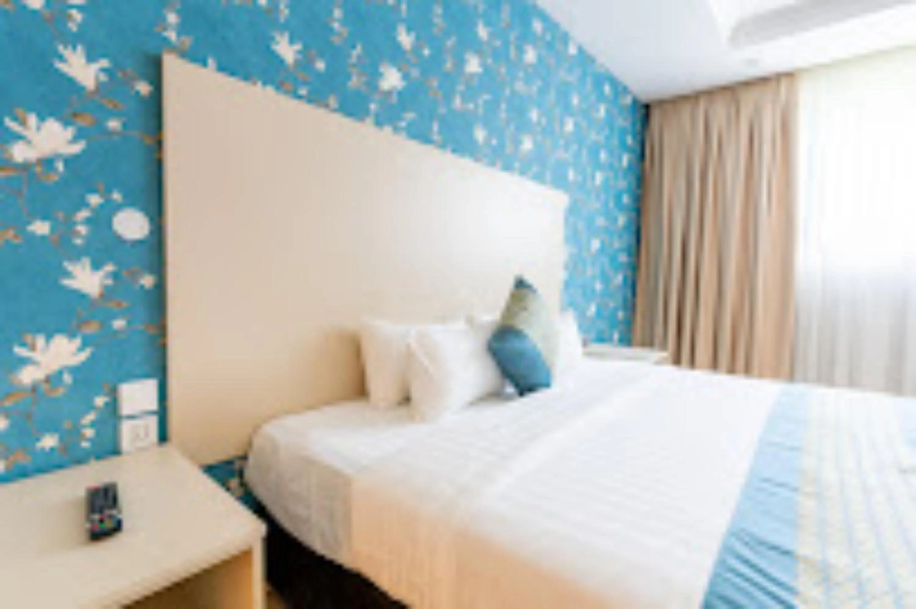 Bed in Blooming Suites