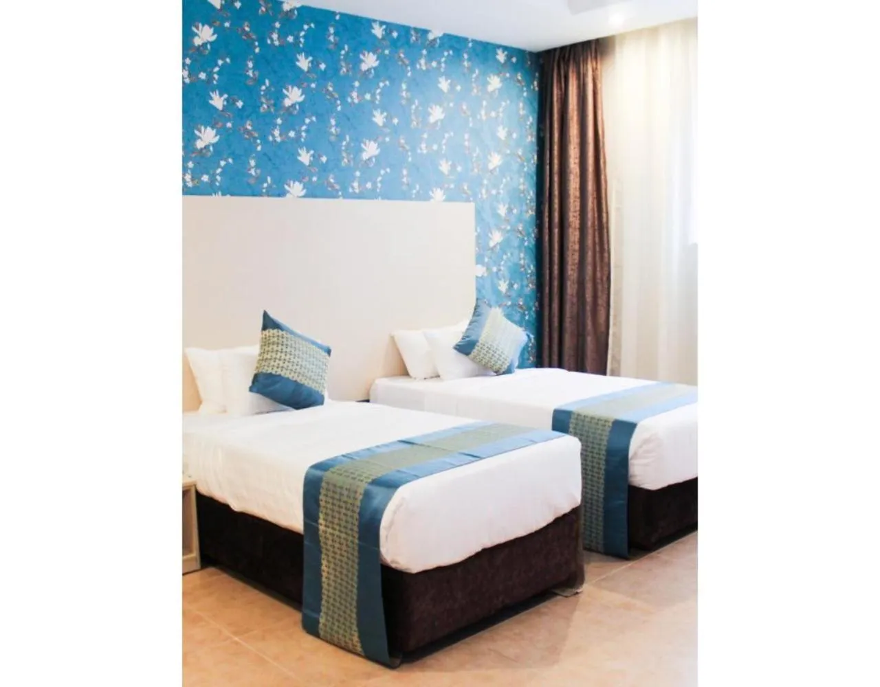 Bed in Blooming Suites