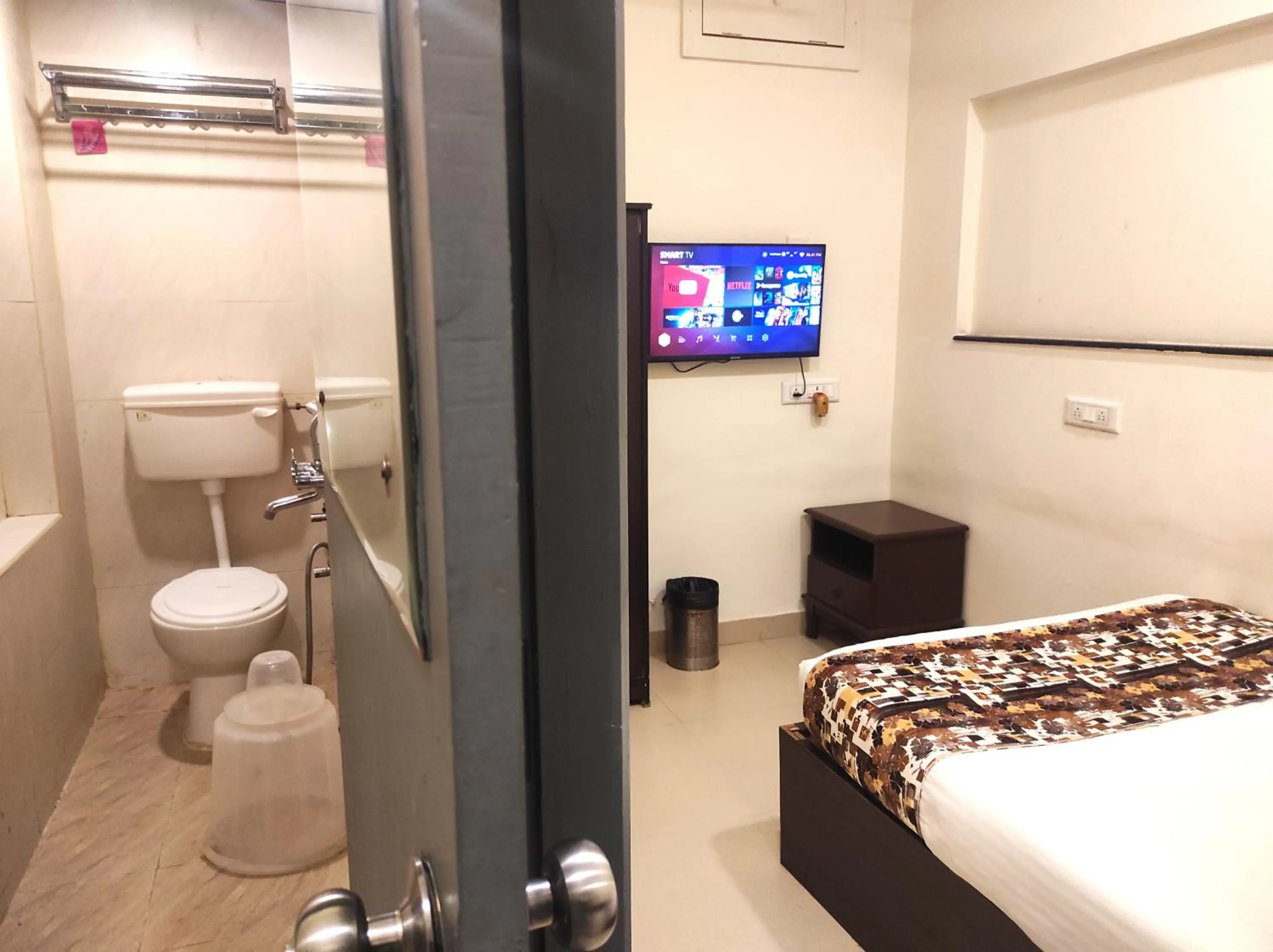 Bed in Athasri Hotel HSR Layout