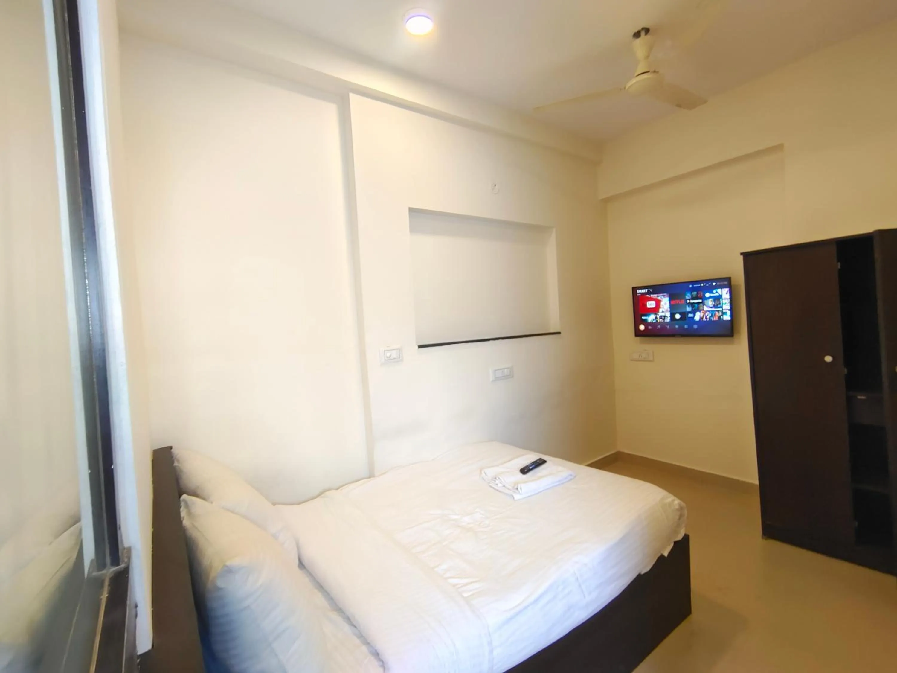 Bed in Athasri Hotel HSR Layout