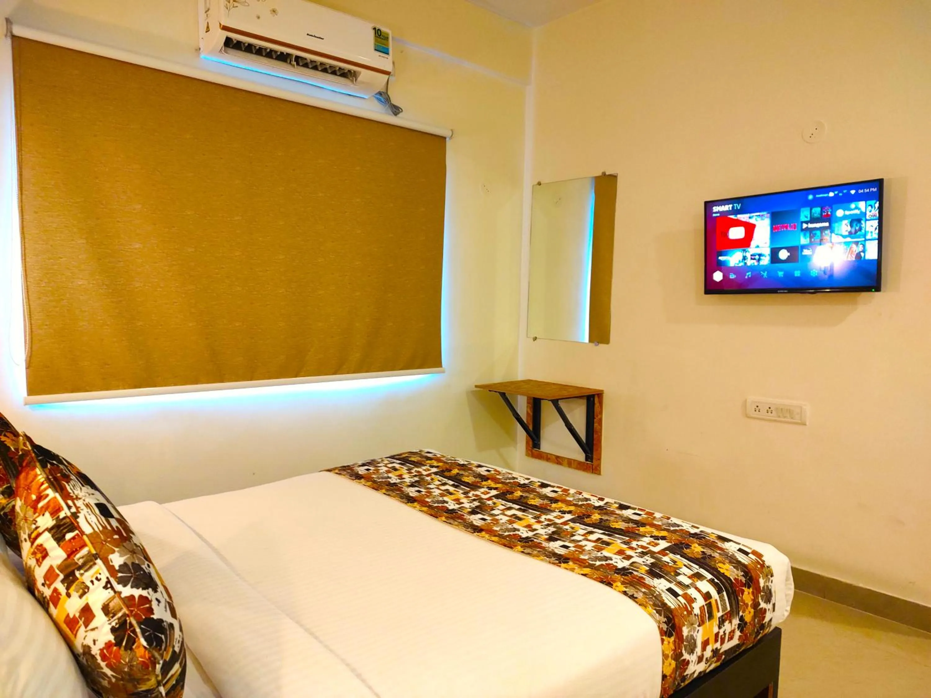 Communal lounge/ TV room in Athasri Hotel HSR Layout