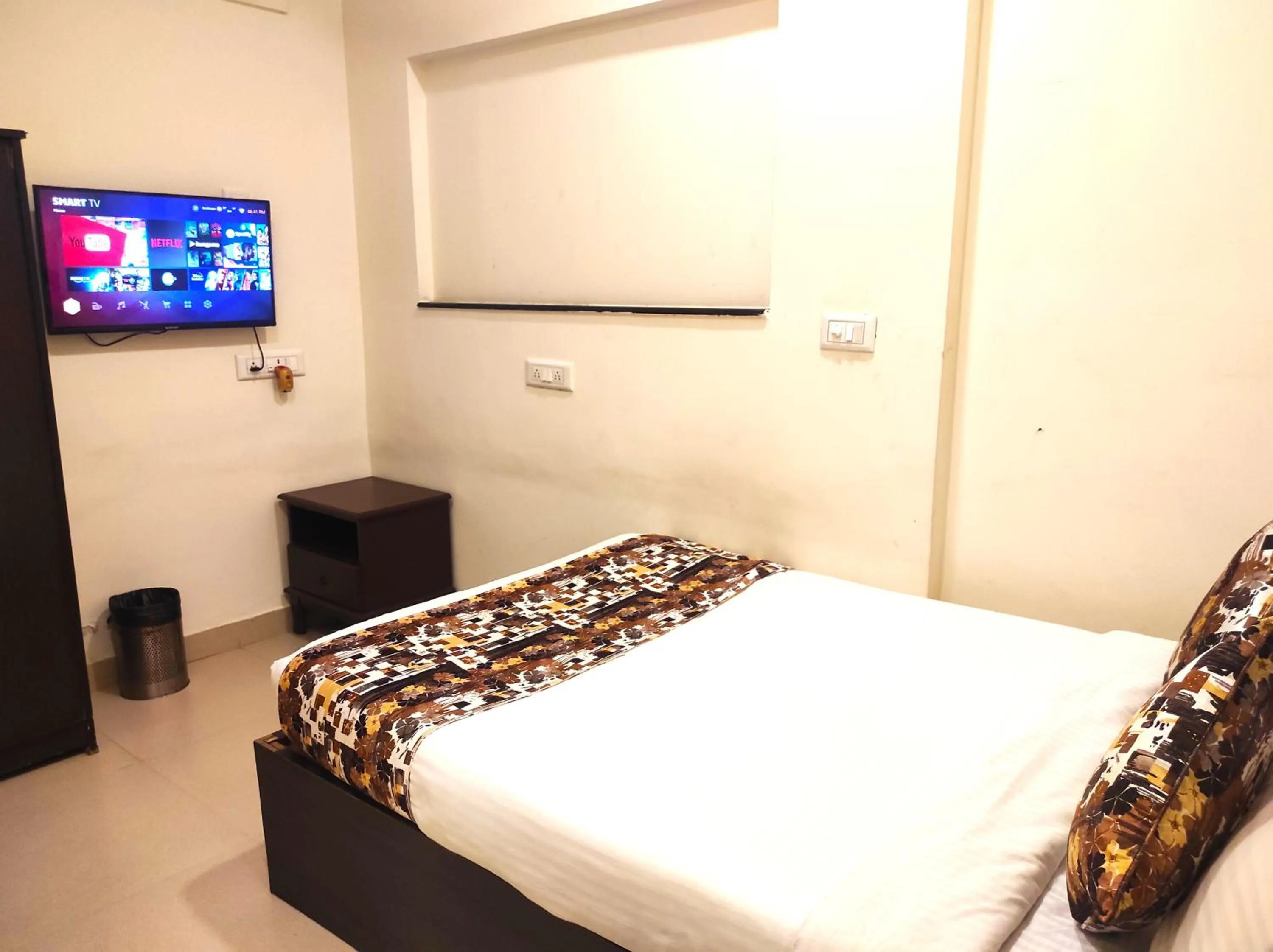 Bed in Athasri Hotel HSR Layout