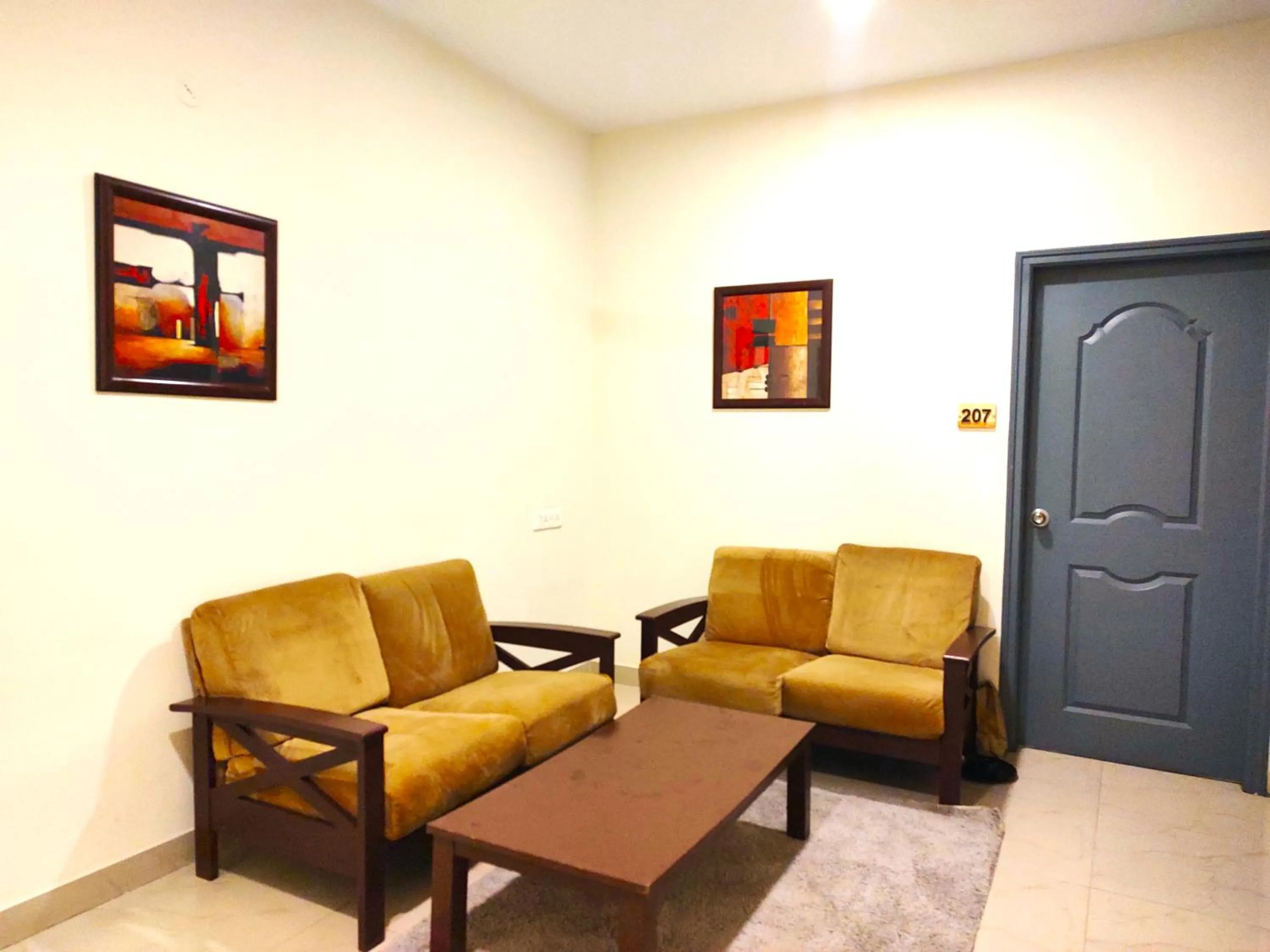 Living room in Athasri Hotel HSR Layout