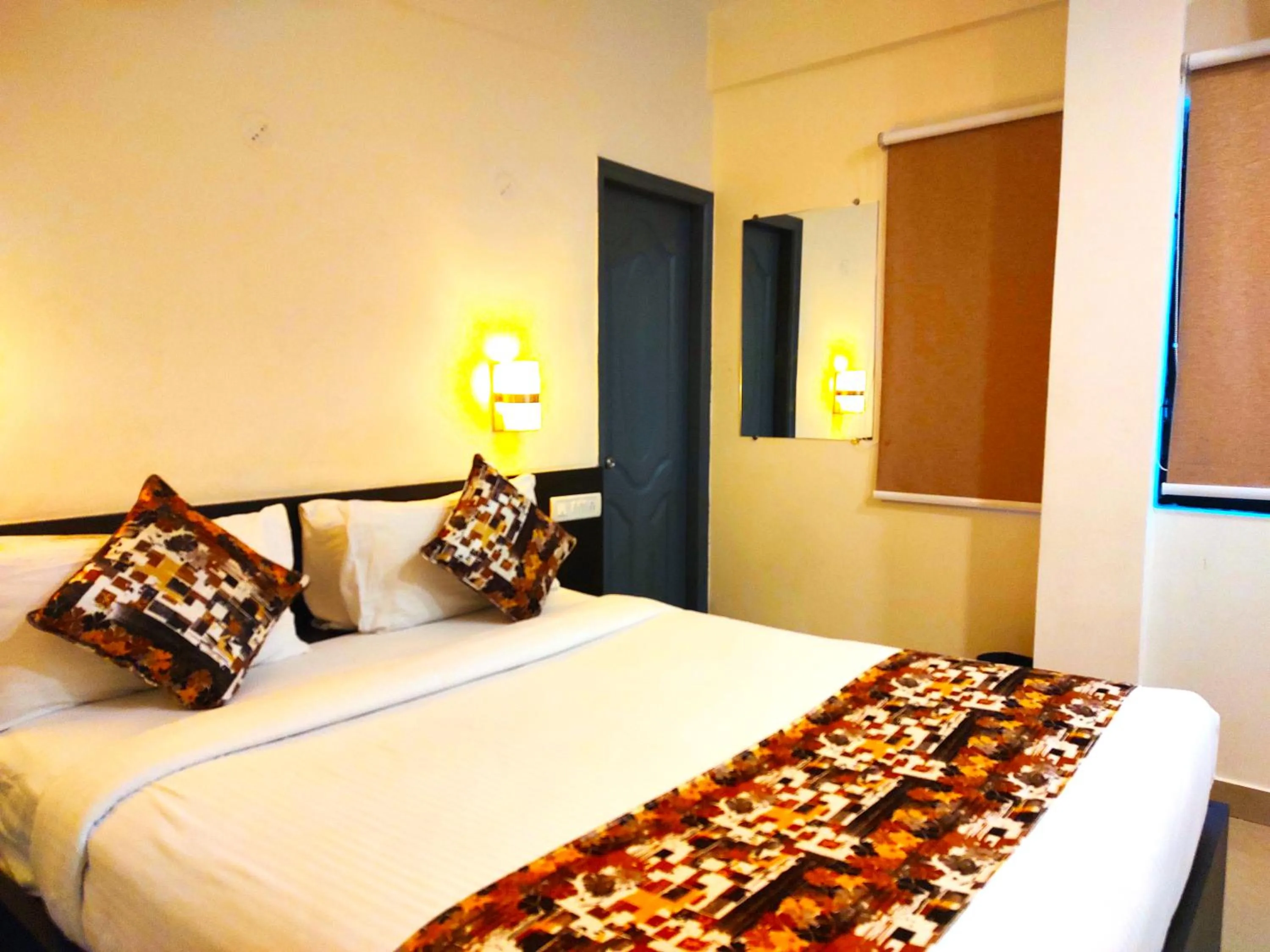 Bed in Athasri Hotel HSR Layout