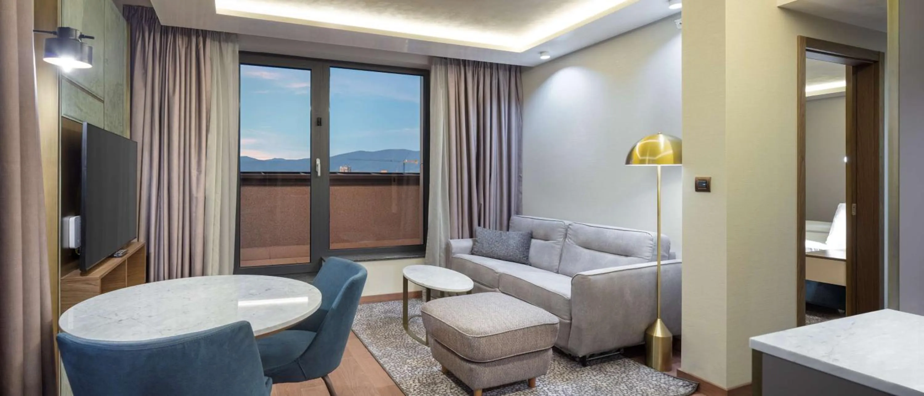 Living room, Bed in Doubletree By Hilton Plovdiv Center