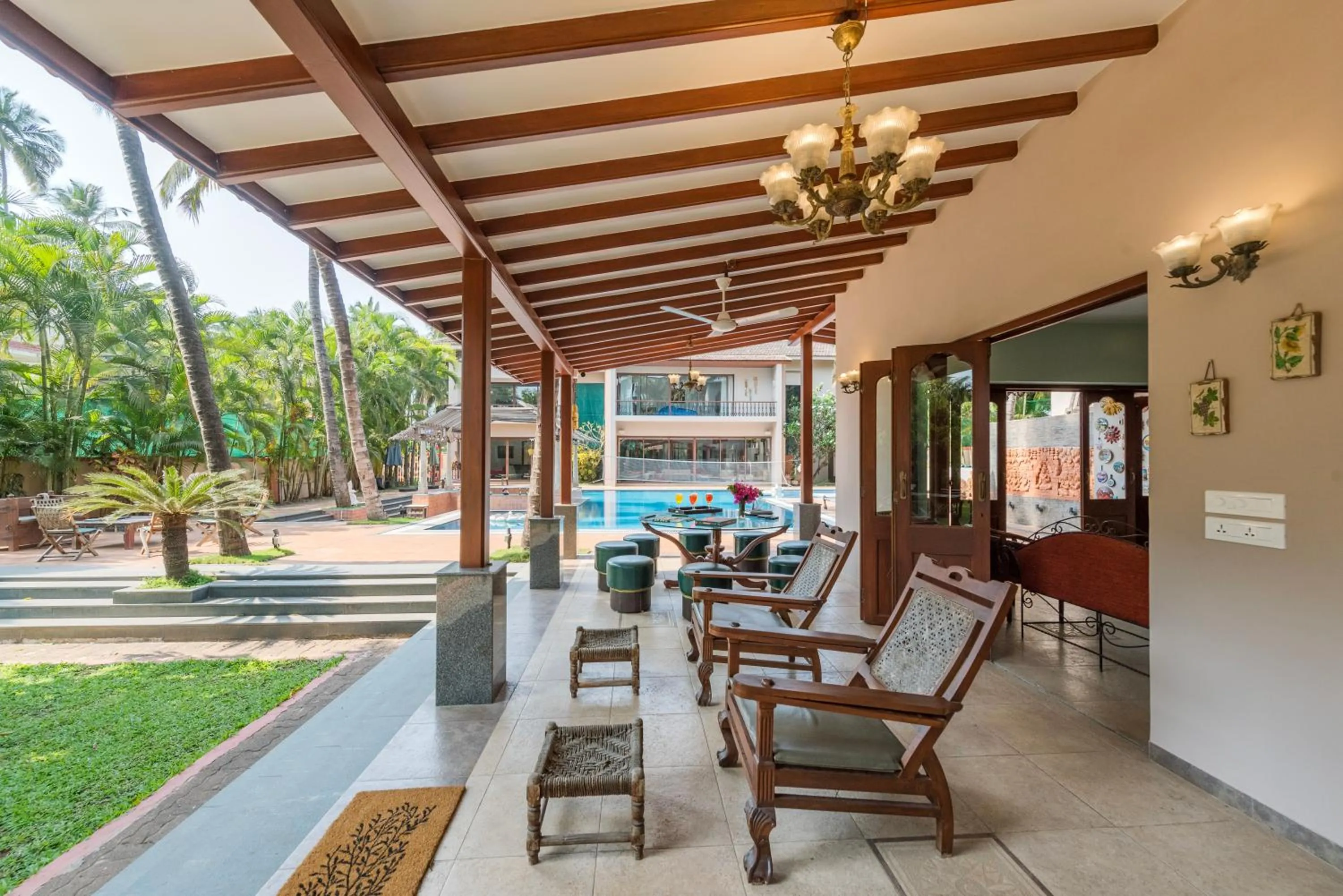 Patio in SaffronStays Casa Del Palms - 8BR luxury pool villa with gazebo, pickleball, bar & lawns near Nagaon Beach