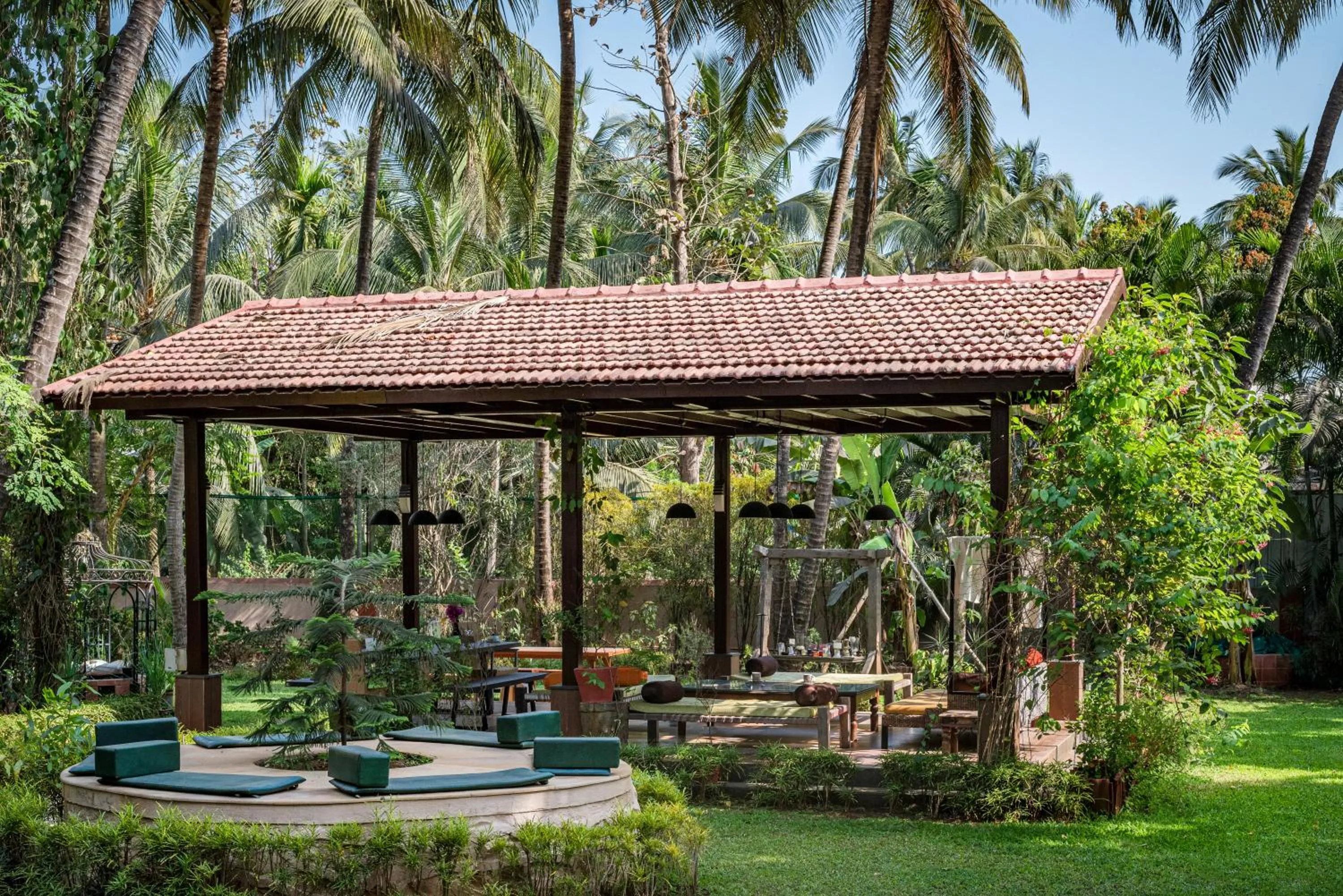 Day in SaffronStays Casa Del Palms - 8BR luxury pool villa with gazebo, pickleball, bar & lawns near Nagaon Beach