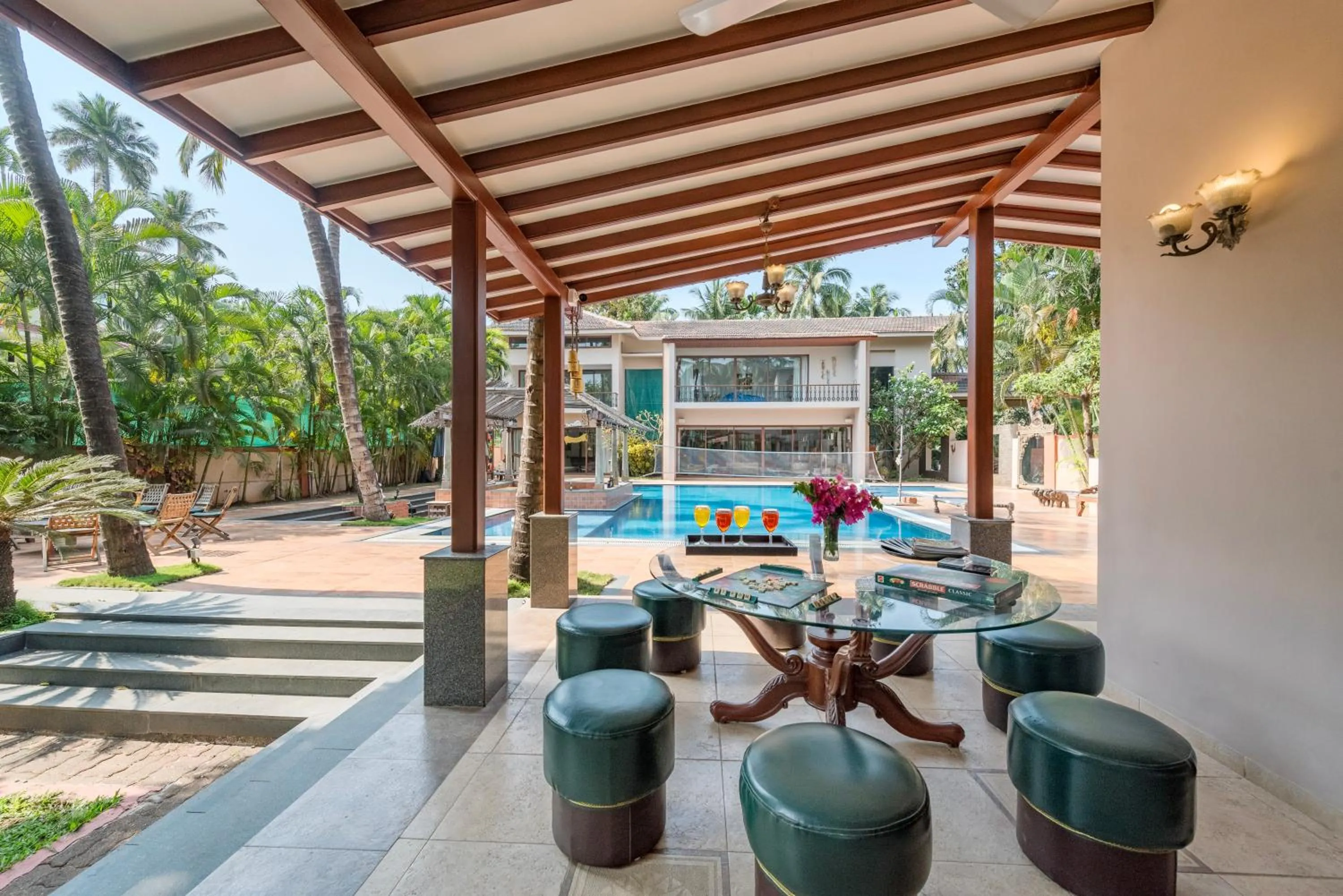 Property building in SaffronStays Casa Del Palms - 8BR luxury pool villa with gazebo, pickleball, bar & lawns near Nagaon Beach