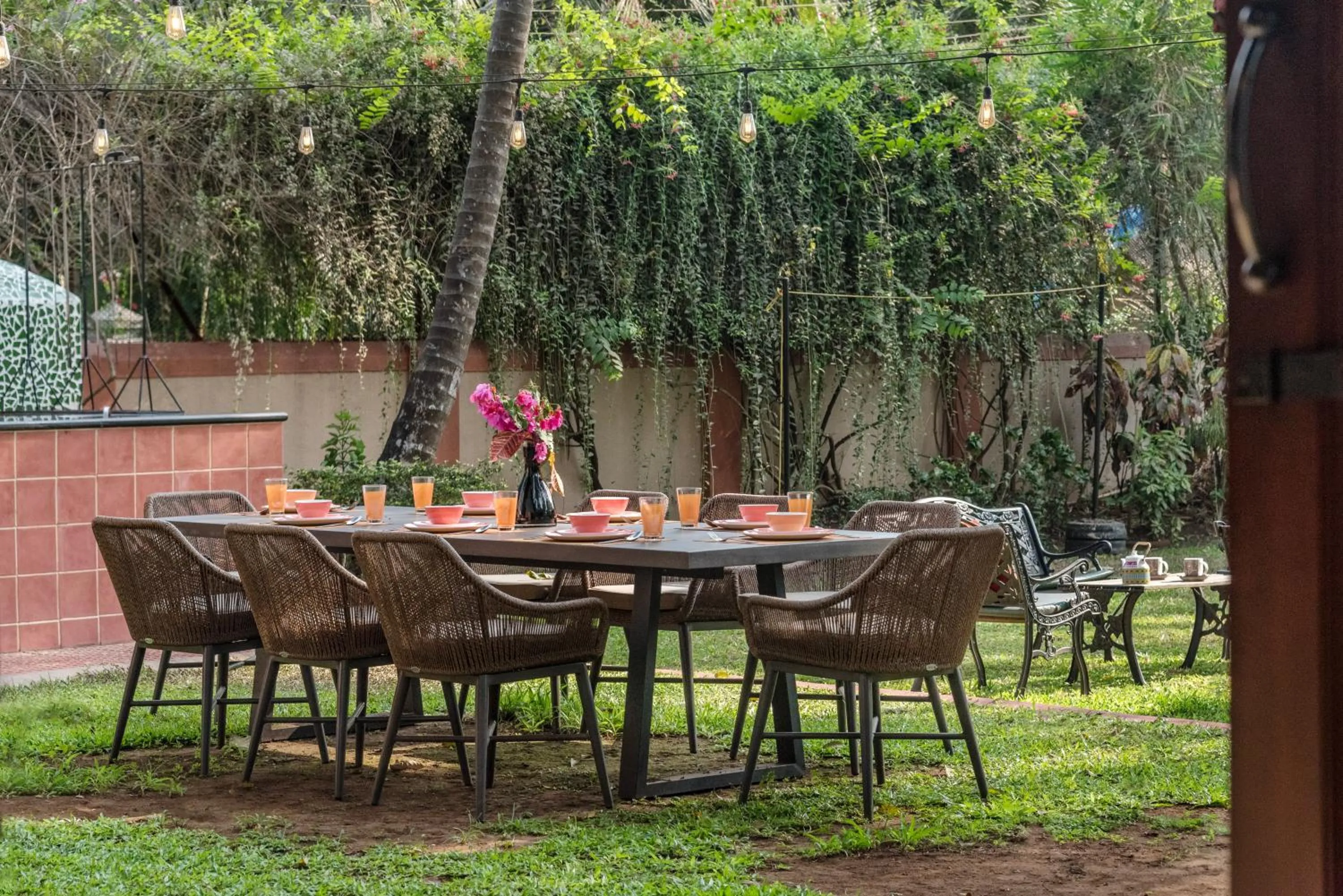 Patio in SaffronStays Casa Del Palms - 8BR luxury pool villa with gazebo, pickleball, bar & lawns near Nagaon Beach