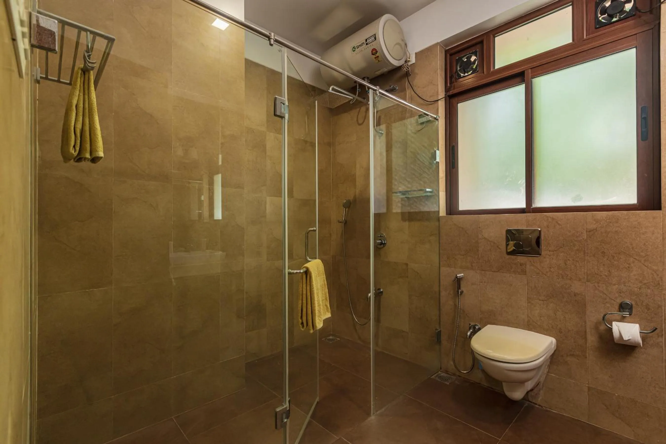 Shower in SaffronStays Casa Del Palms - 8BR luxury pool villa with gazebo, pickleball, bar & lawns near Nagaon Beach